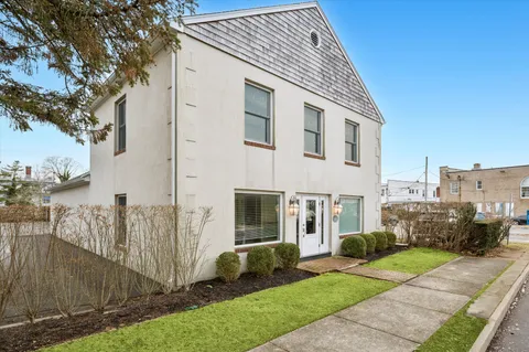 a view of a livingroom with furniture and a window