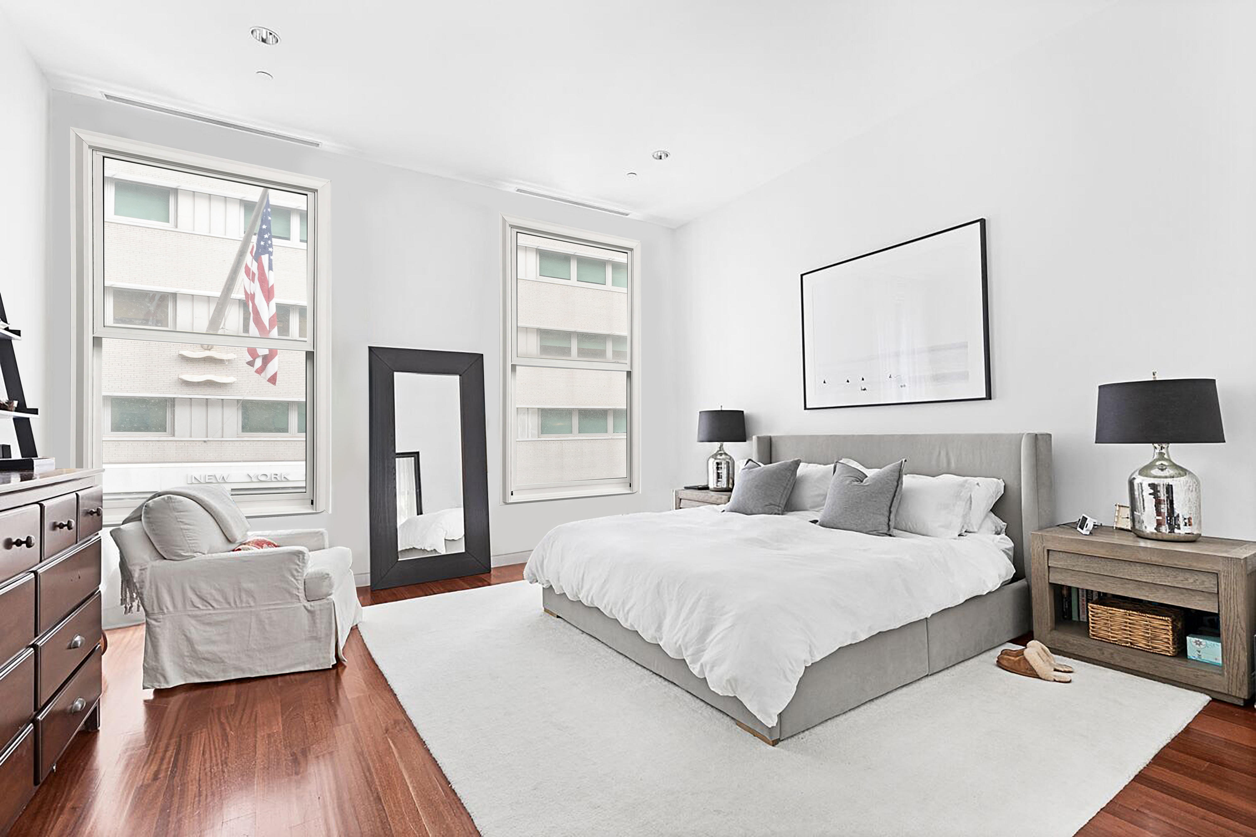 52 Thomas Street, Unit 2B Manhattan, NY 10013 - Photo 5 of 9 a bedroom with a bed and wooden floor