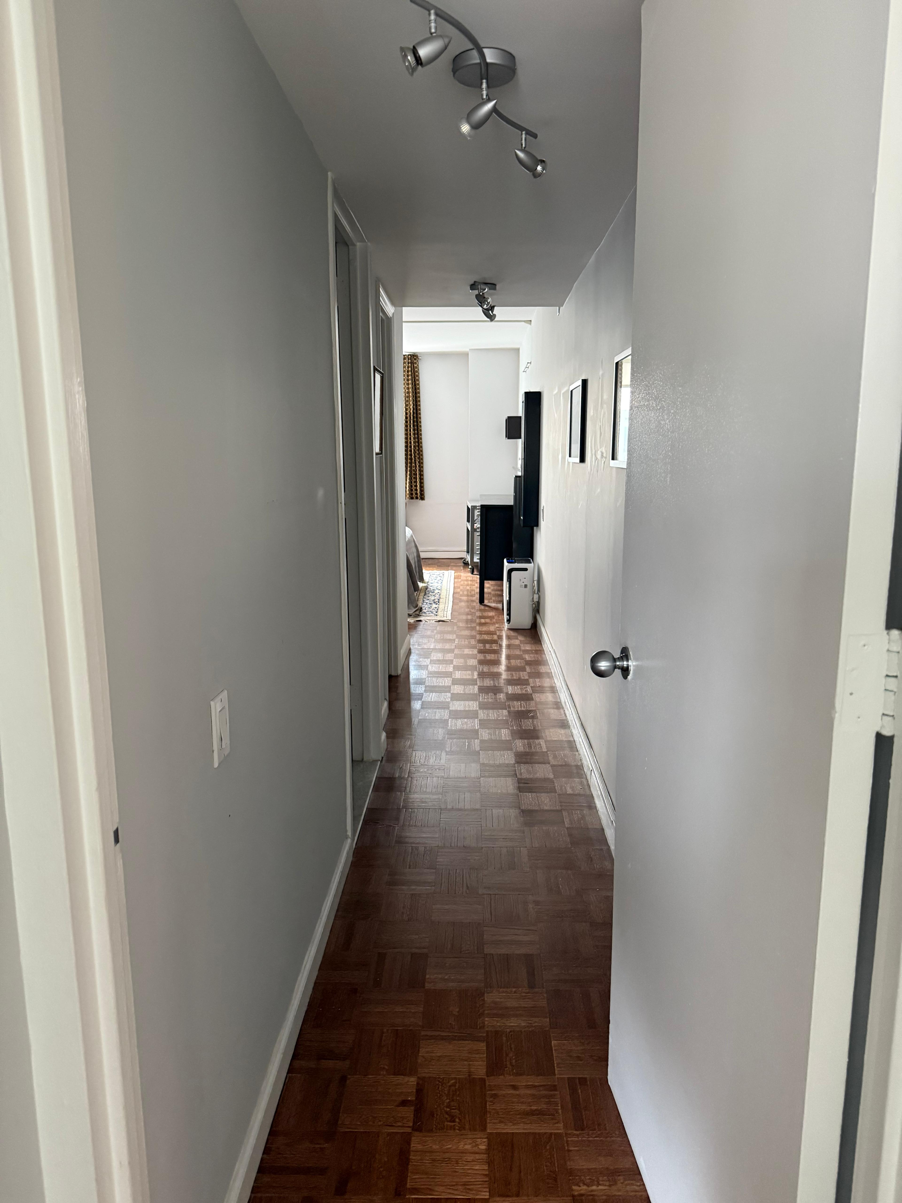 275 Greenwich Street, Unit 11G Manhattan, NY 10007 - Photo 7 of 18 a view of a hallway with furniture