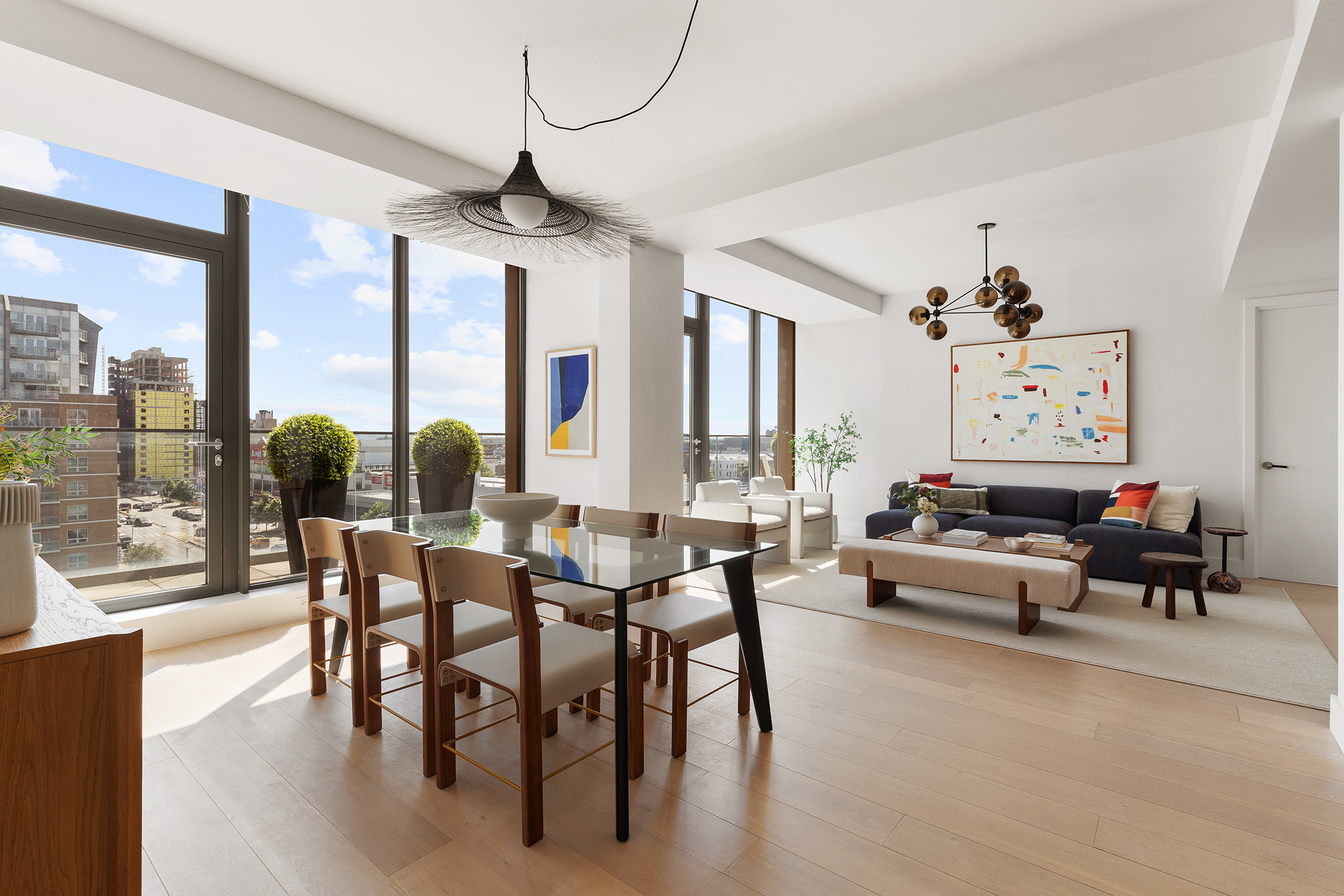 251 1st Street, Unit 7F Brooklyn, NY 11215 - Photo 1 of 24 a living room with furniture a large window and a dining table