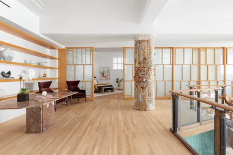 a bedroom with a bed and a couch