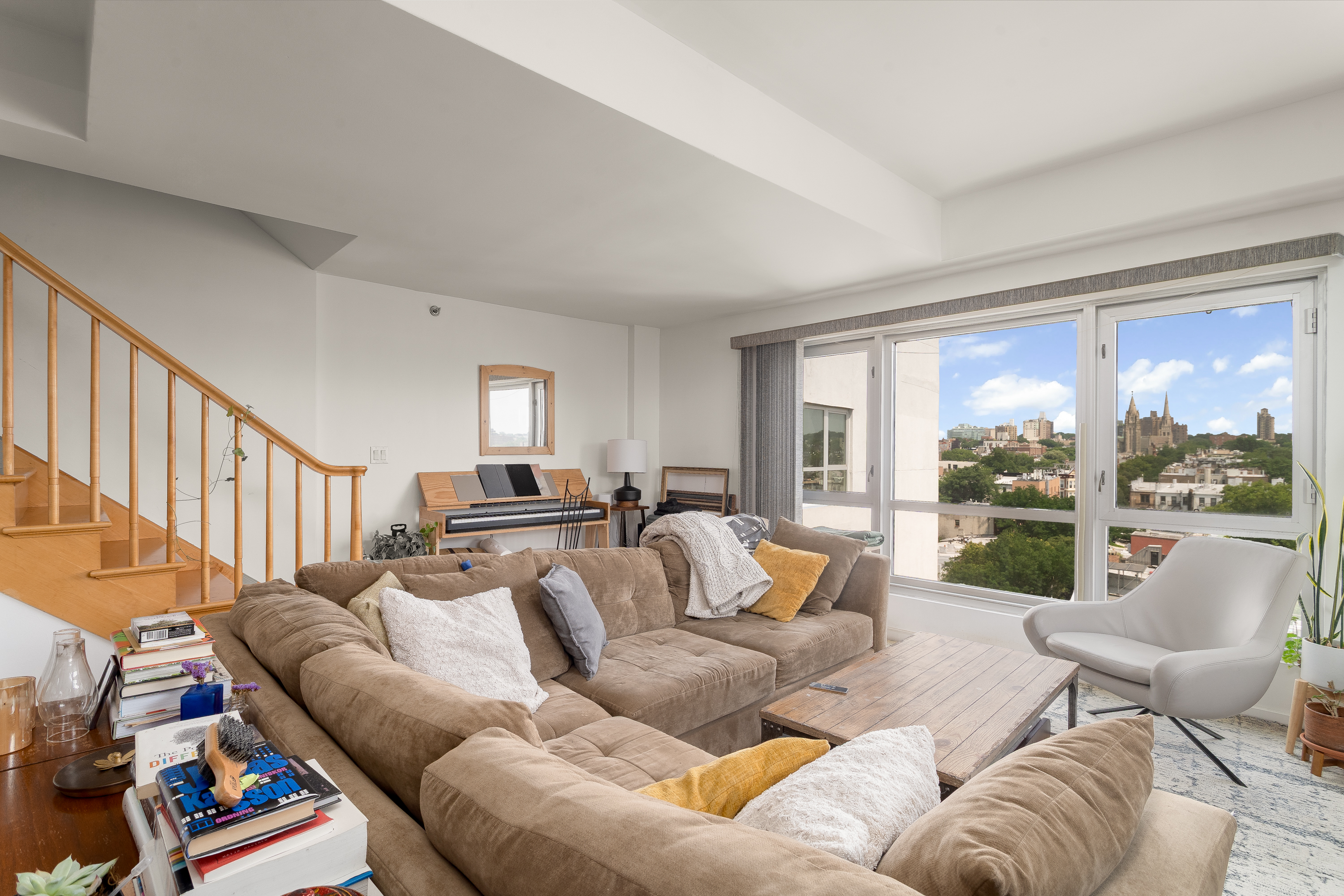 560 Carroll Street, Unit 11A Brooklyn, NY 11215 - Photo 6 of 15 a living room with furniture and a large window