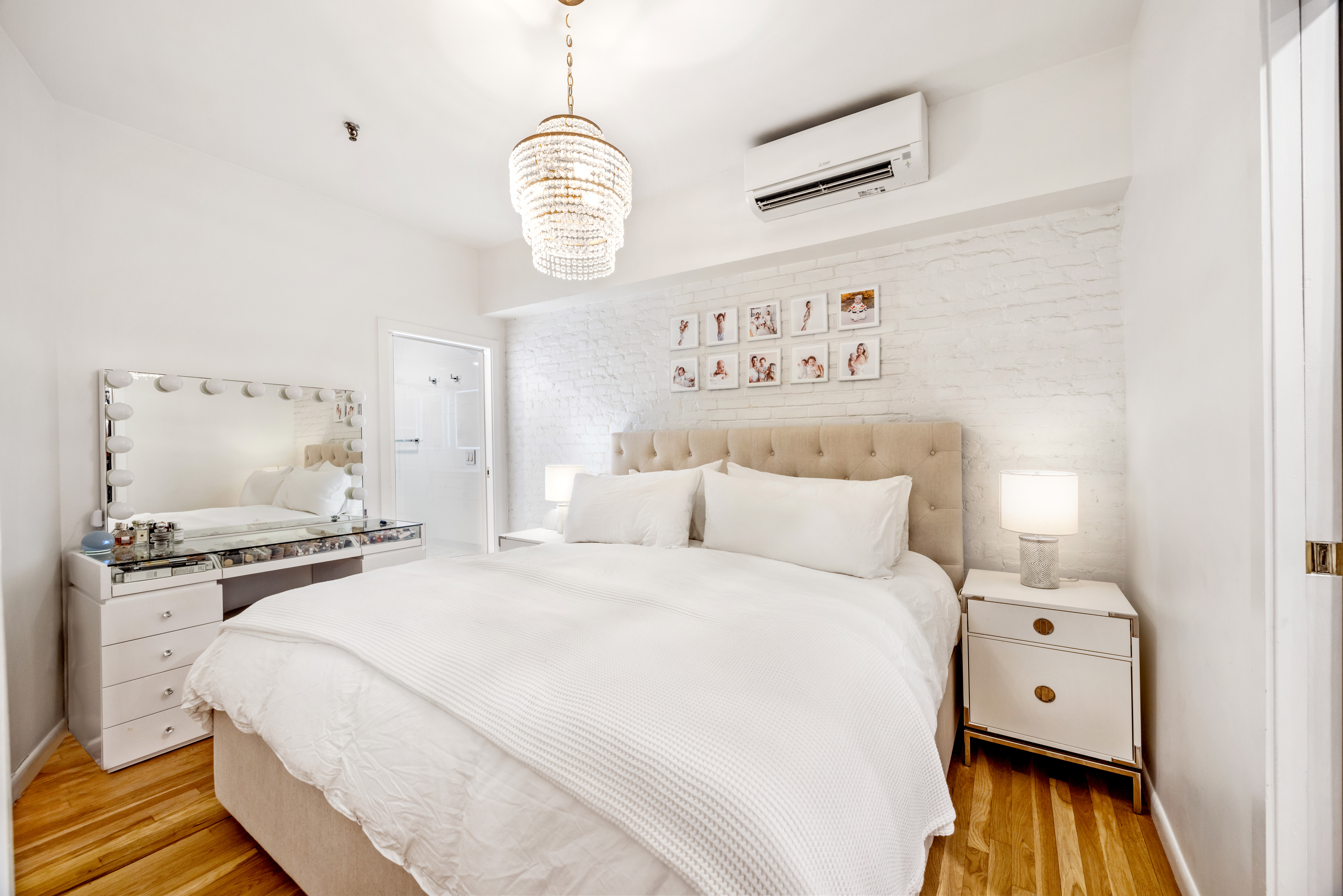 43 Murray Street, Unit Undisclosed Manhattan, NY 10007 - Photo 9 of 12 a bedroom with a bed and a chandelier