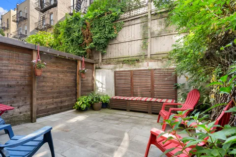 a backyard of a house with outdoor seating