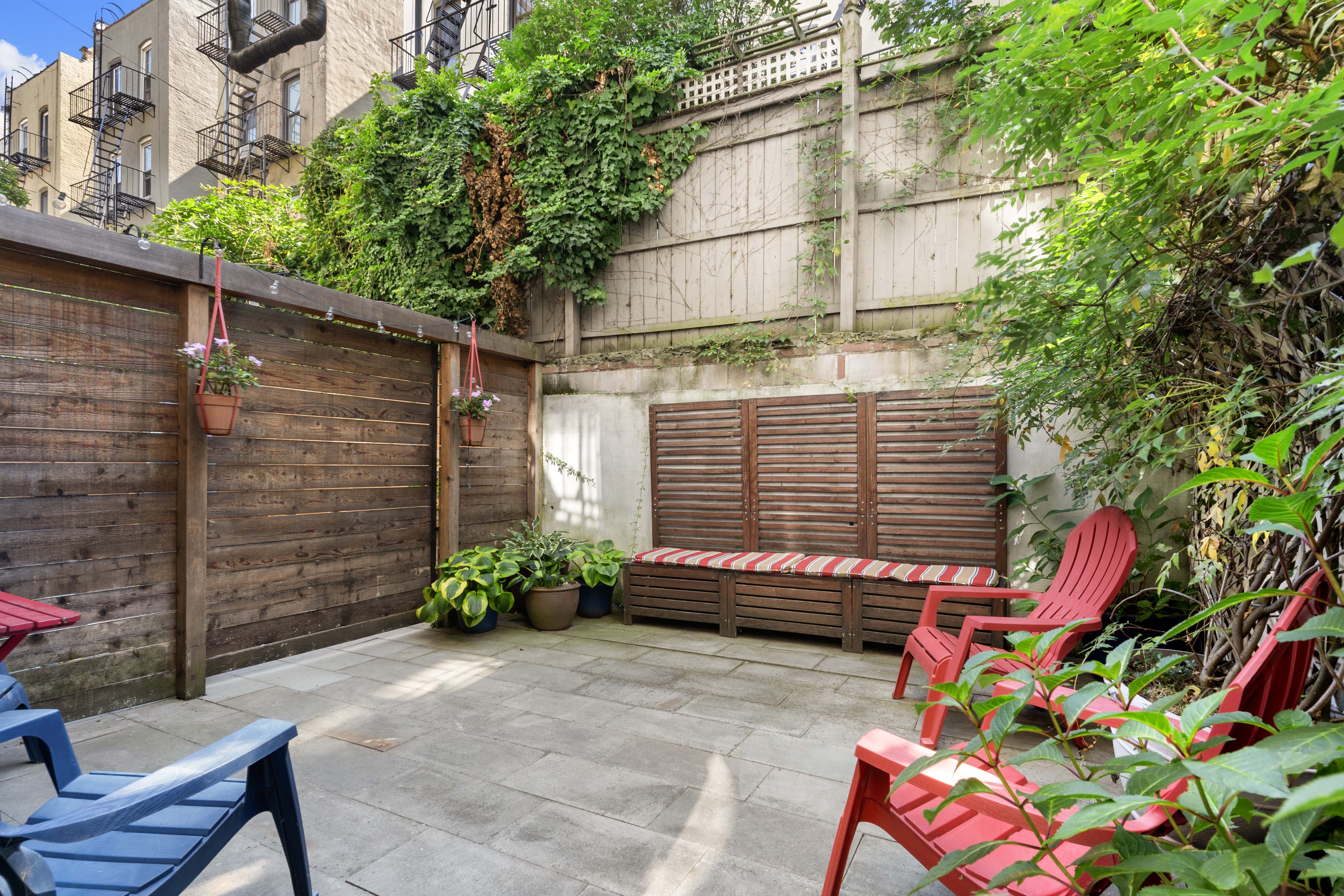 456 15th Street, Unit 1R Brooklyn, NY 11215 - Photo 10 of 14 a backyard of a house with outdoor seating