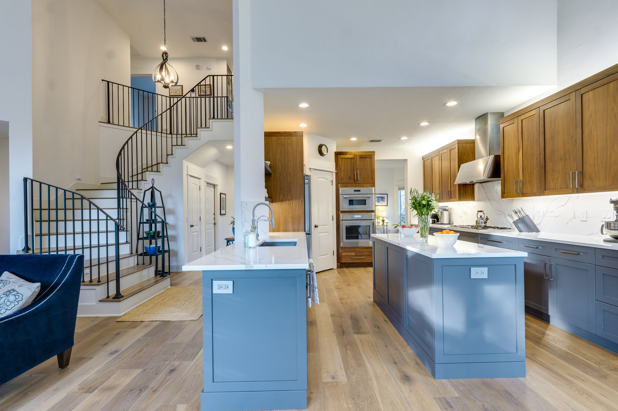 109 West Spring Drive Austin, TX 78746 - Photo 11 of 22 a kitchen with stainless steel appliances kitchen island granite countertop wooden floor and a view of living room