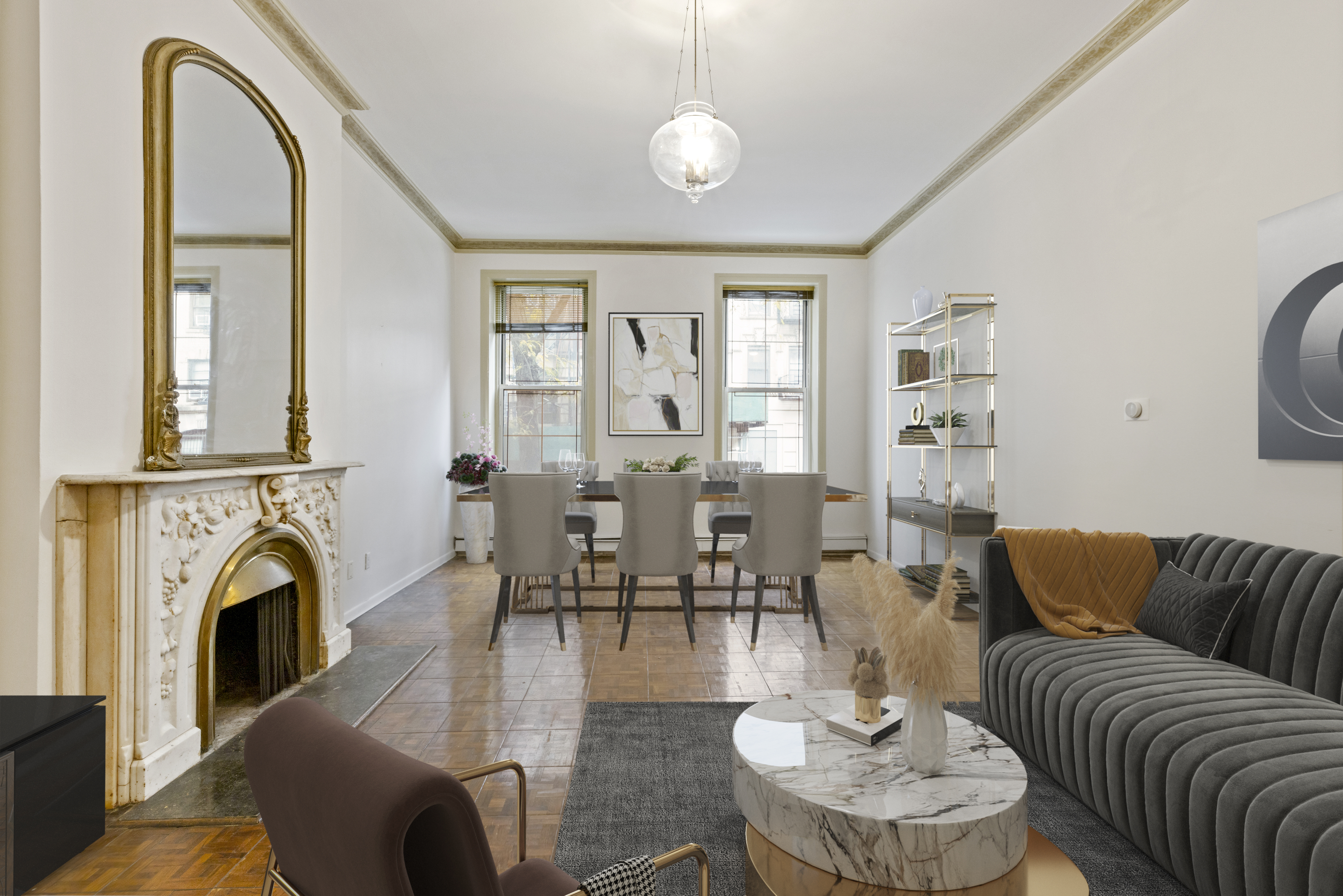 136 East 30th Street, Unit DUPLEX Manhattan, NY 10016 - Photo 2 of 26 a living room with furniture a fireplace and a chandelier