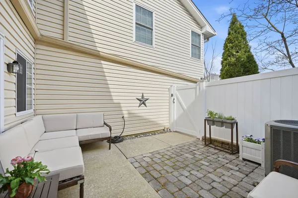 a view of a terrace with couches and potted plants