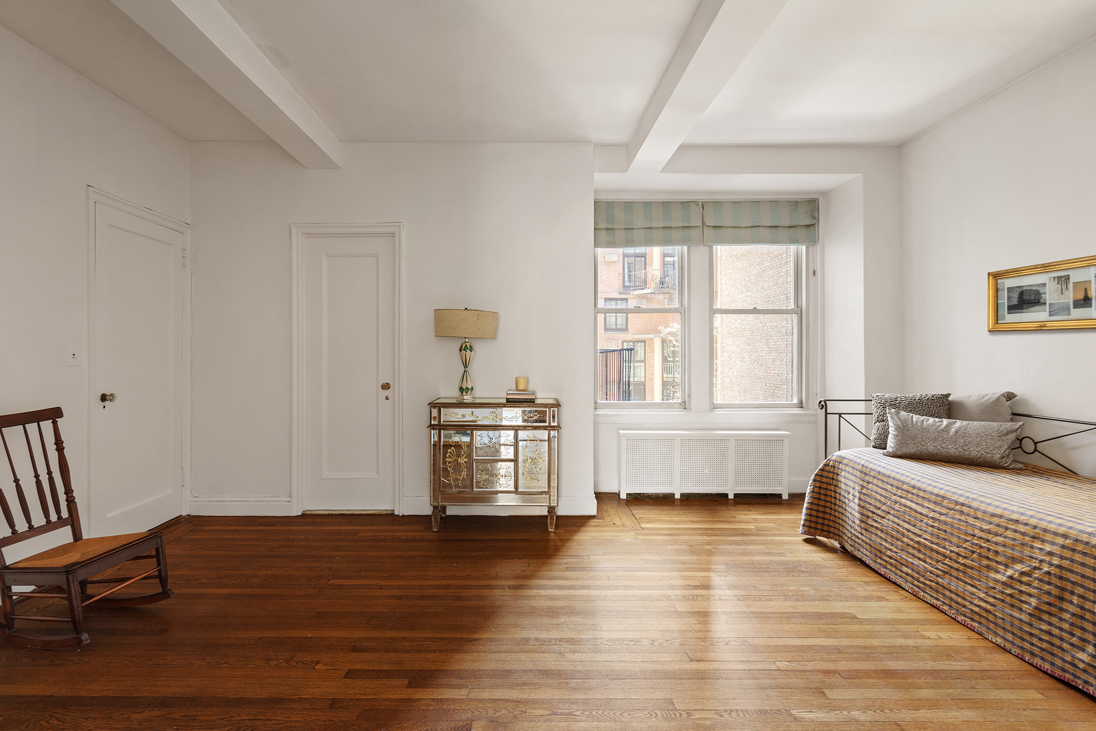 45 Gramercy Park North, Unit 4B Manhattan, NY 10010 - Photo 6 of 13 a bedroom with furniture and window