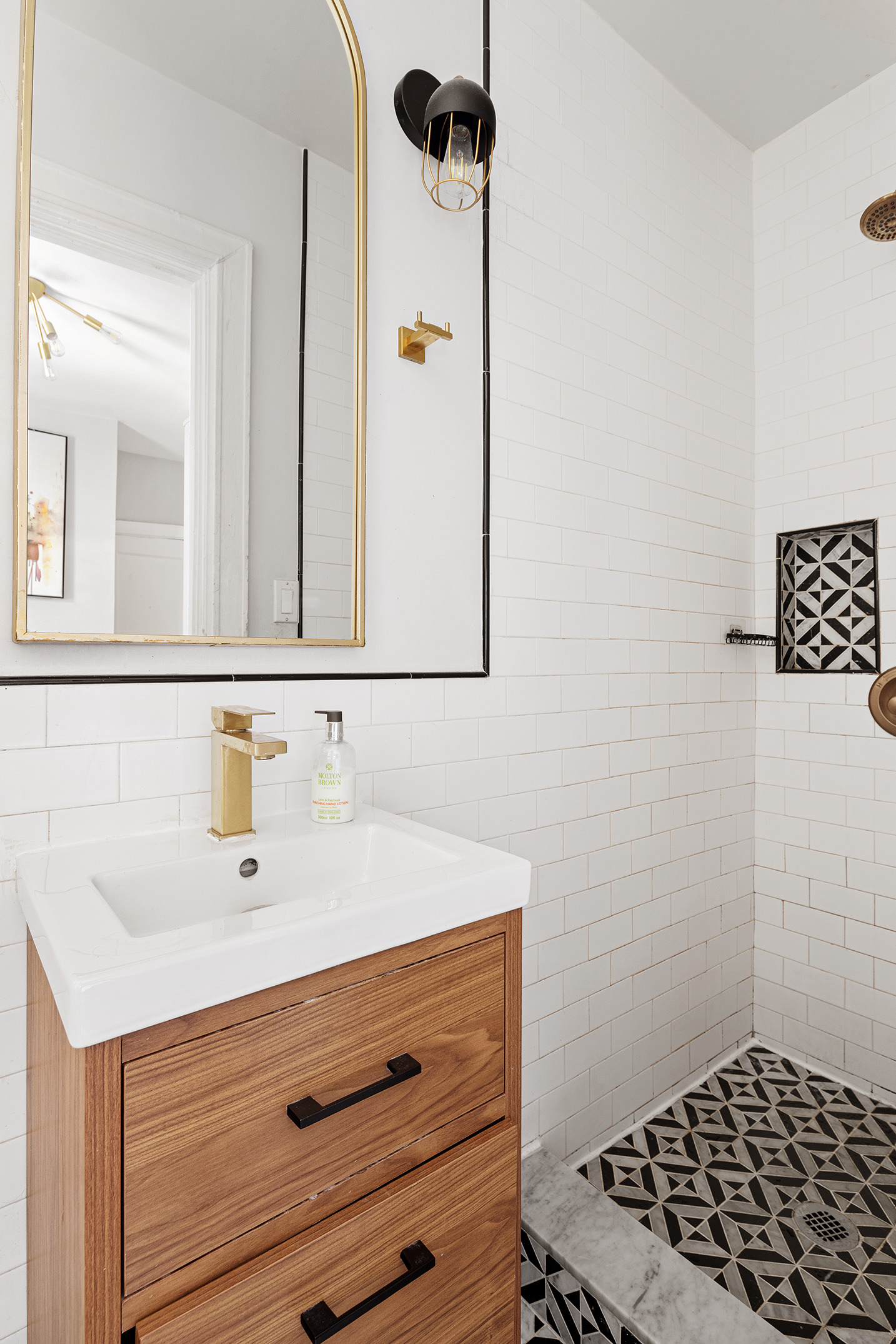 370 Central Park West, Unit PH601 Manhattan, NY 10025 - Photo 16 of 19 a bathroom with a sink a mirror and shower