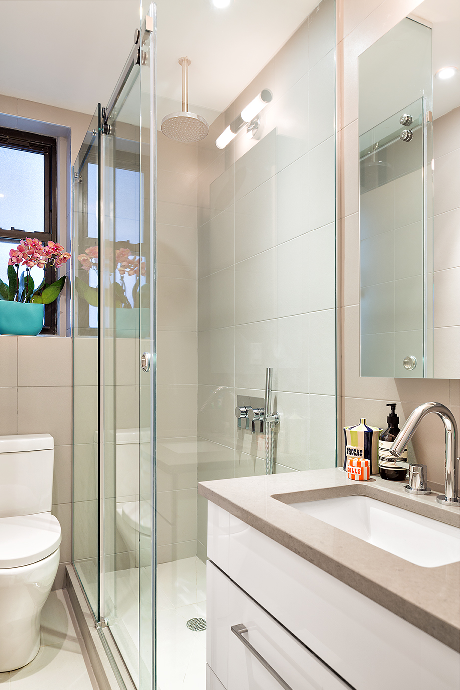 245 West 25th Street, Unit PHD Manhattan, NY 10001 - Photo 6 of 16 a bathroom with a sink a toilet and shower