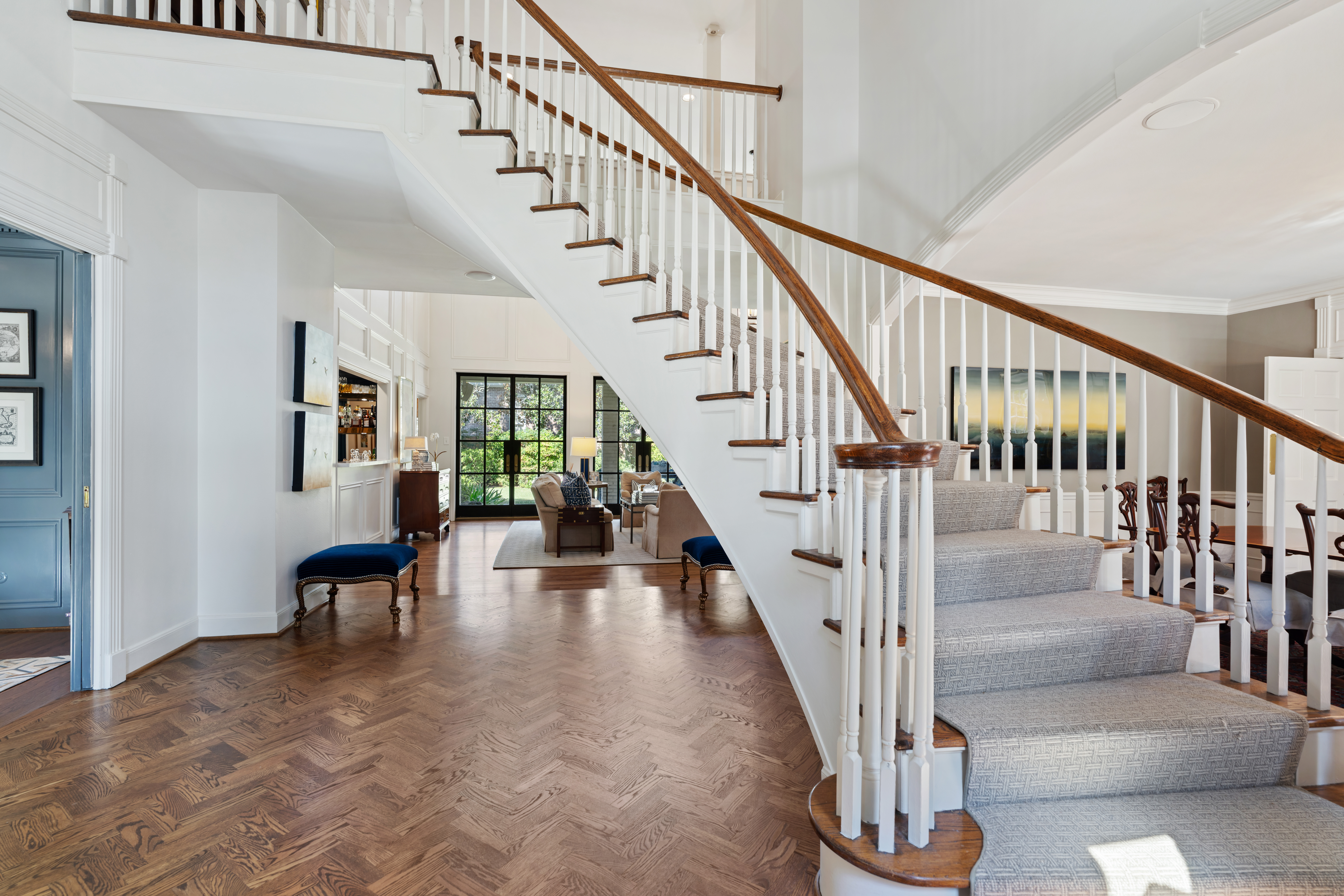711 Pifer Road Houston, TX 77024 - Photo 8 of 53 a view of staircase with wooden floor and a rug