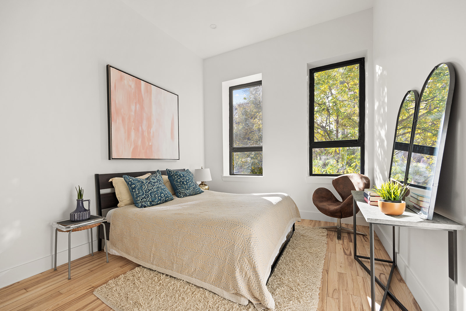 1039 Fulton Street Brooklyn, NY 11238 - Photo 6 of 13 a bedroom with a bed and a large window