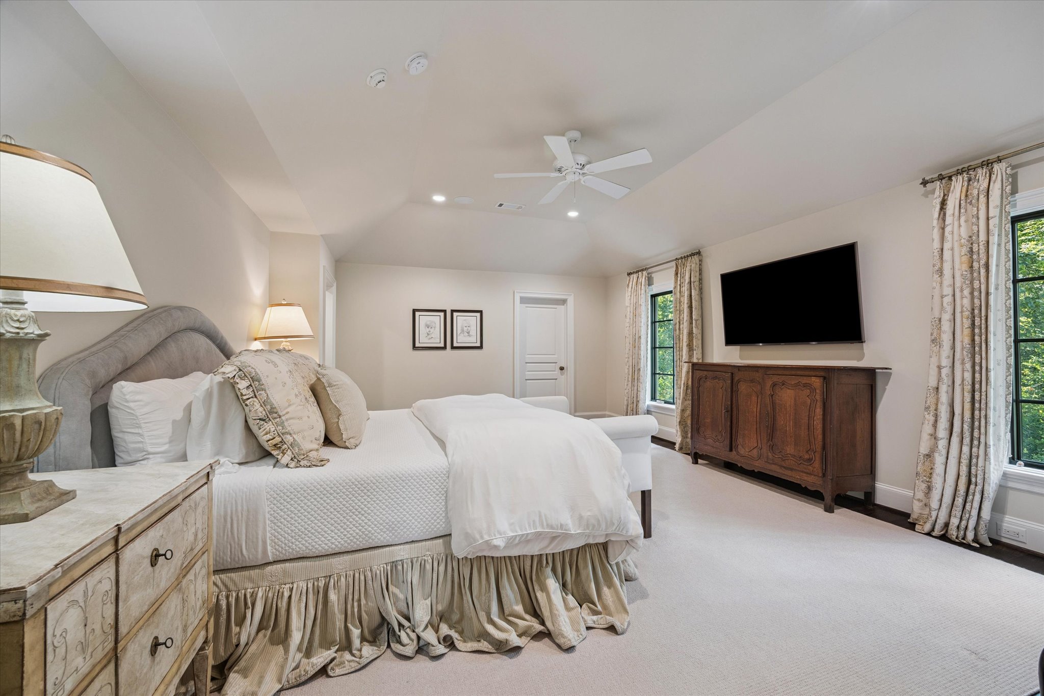 310 Longwoods Lane Houston, TX 77024 - Photo 26 of 49 a bedroom with a bed and a flat screen tv