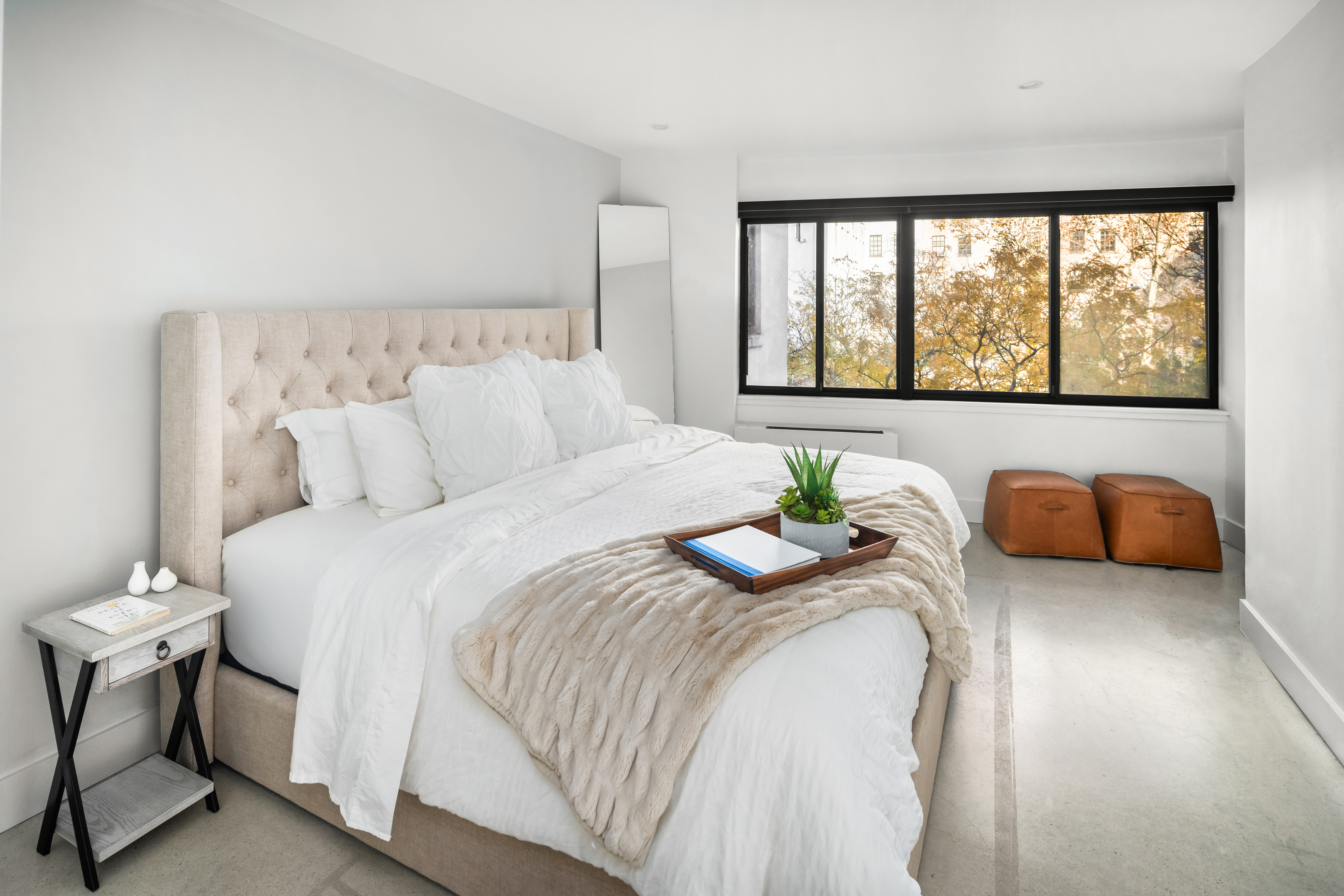 164 Bank Street, Unit 3A Manhattan, NY 10014 - Photo 5 of 8 a bedroom with a bed and a large window