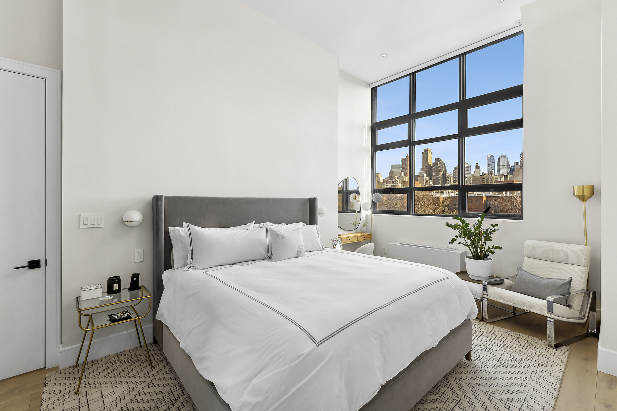 360 Furman Street, Unit 507/508 Brooklyn, NY 11201 - Photo 9 of 43 a bedroom with a bed a couch and a window