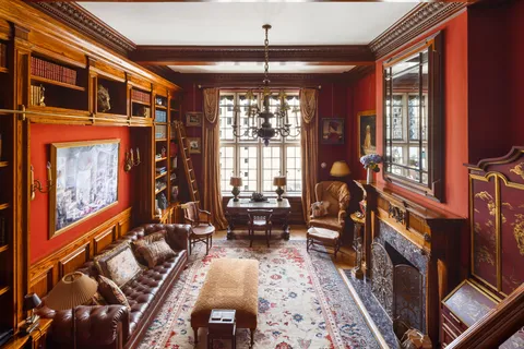a living room with furniture fireplace and flat screen tv