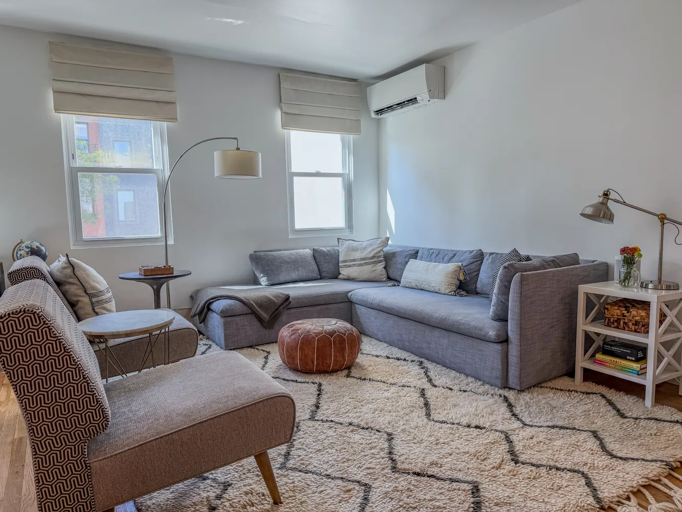 a living room with furniture and a window