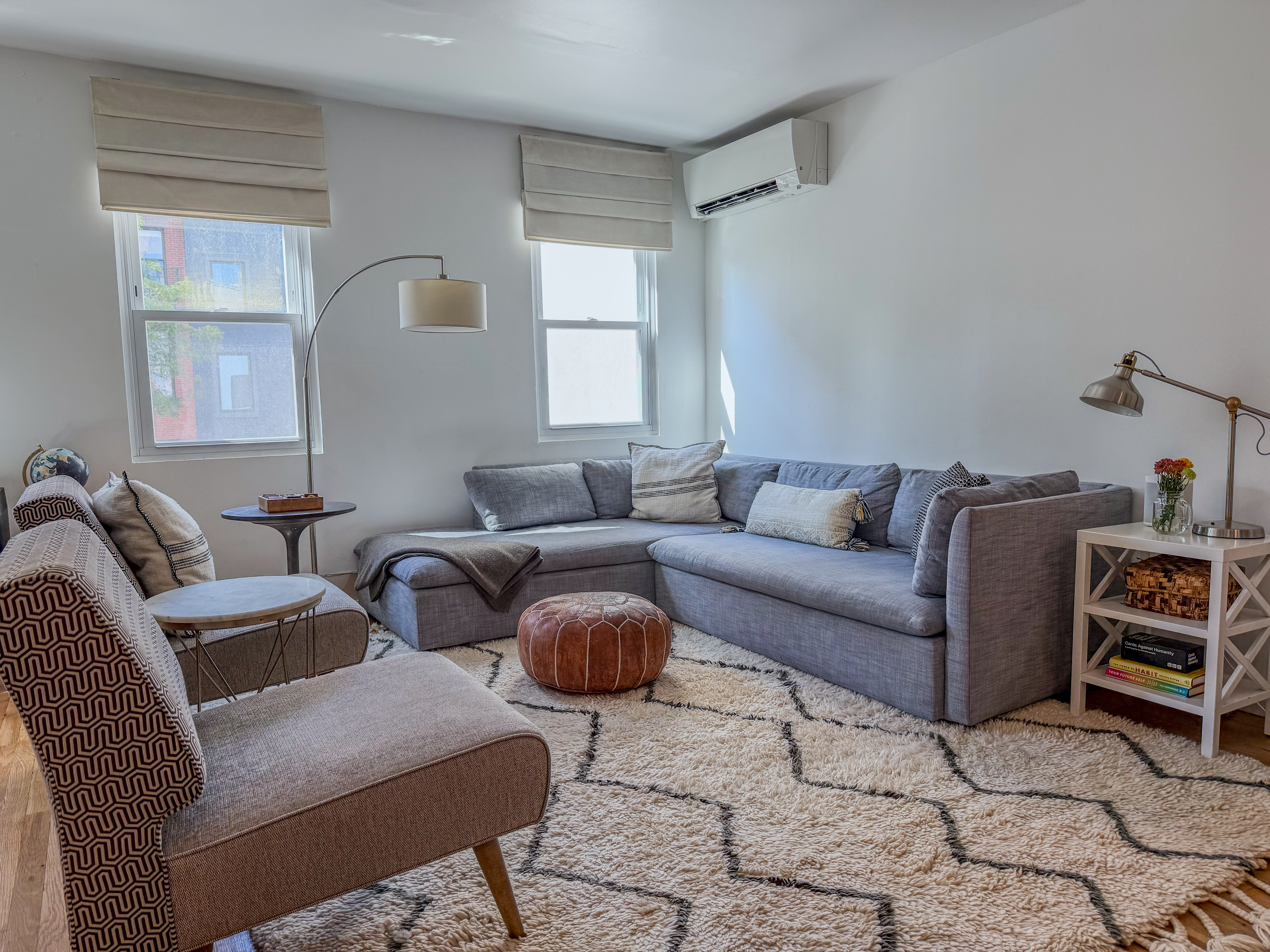 a living room with furniture and a window