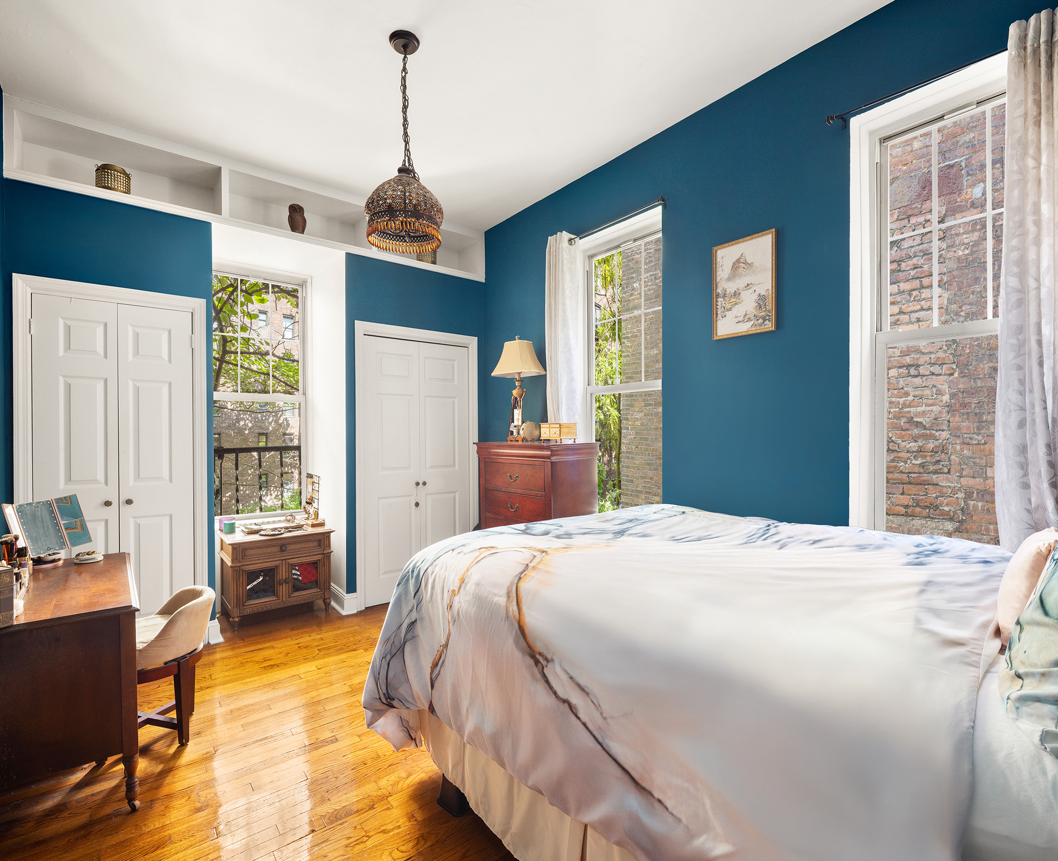 175 East 93rd Street, Unit 3B Manhattan, NY 10128 - Photo 5 of 12 a bedroom with a bed dresser and a window