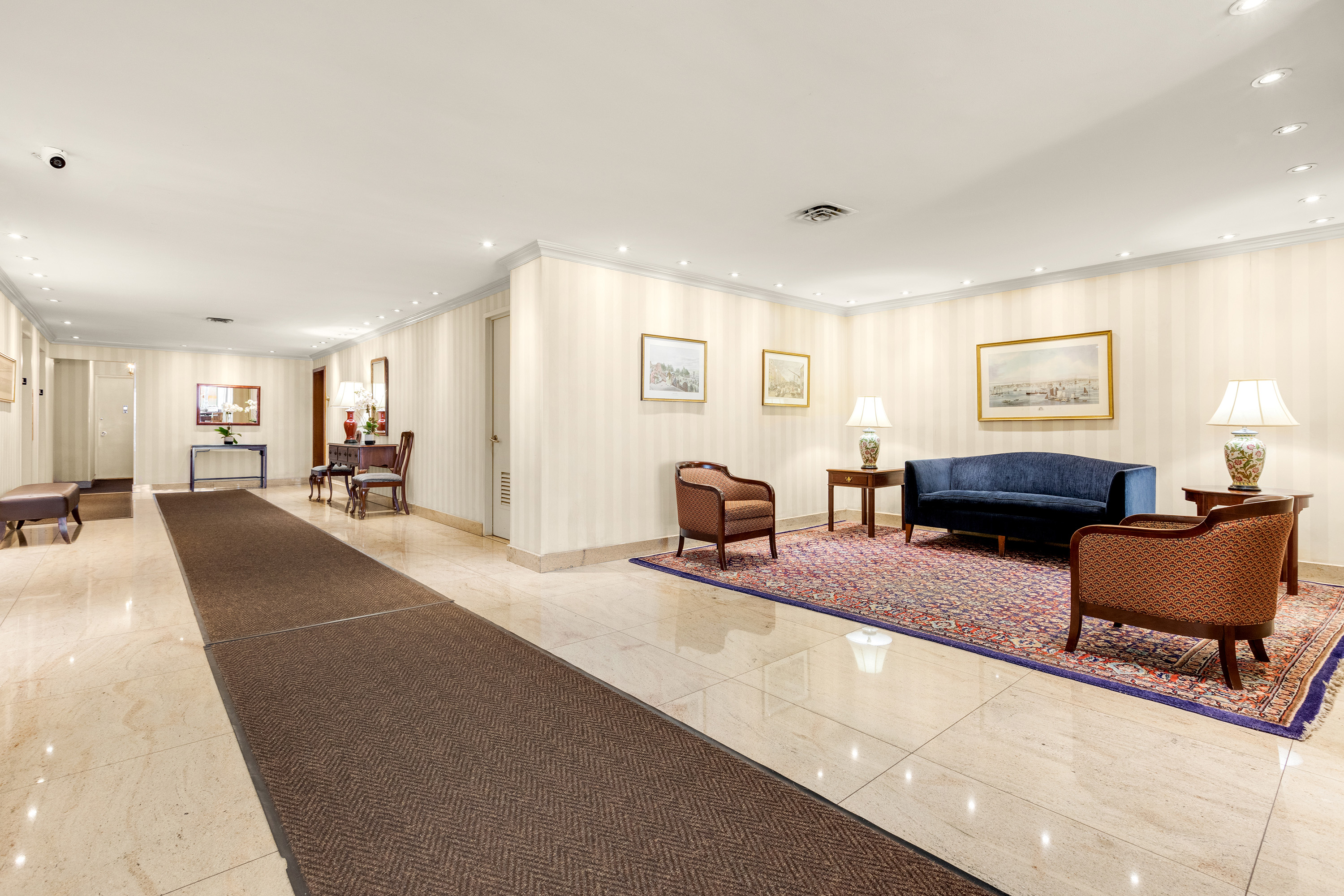 525 East 86th Street, Unit 2G Manhattan, NY 10028 - Photo 10 of 12 a living room with furniture and a table