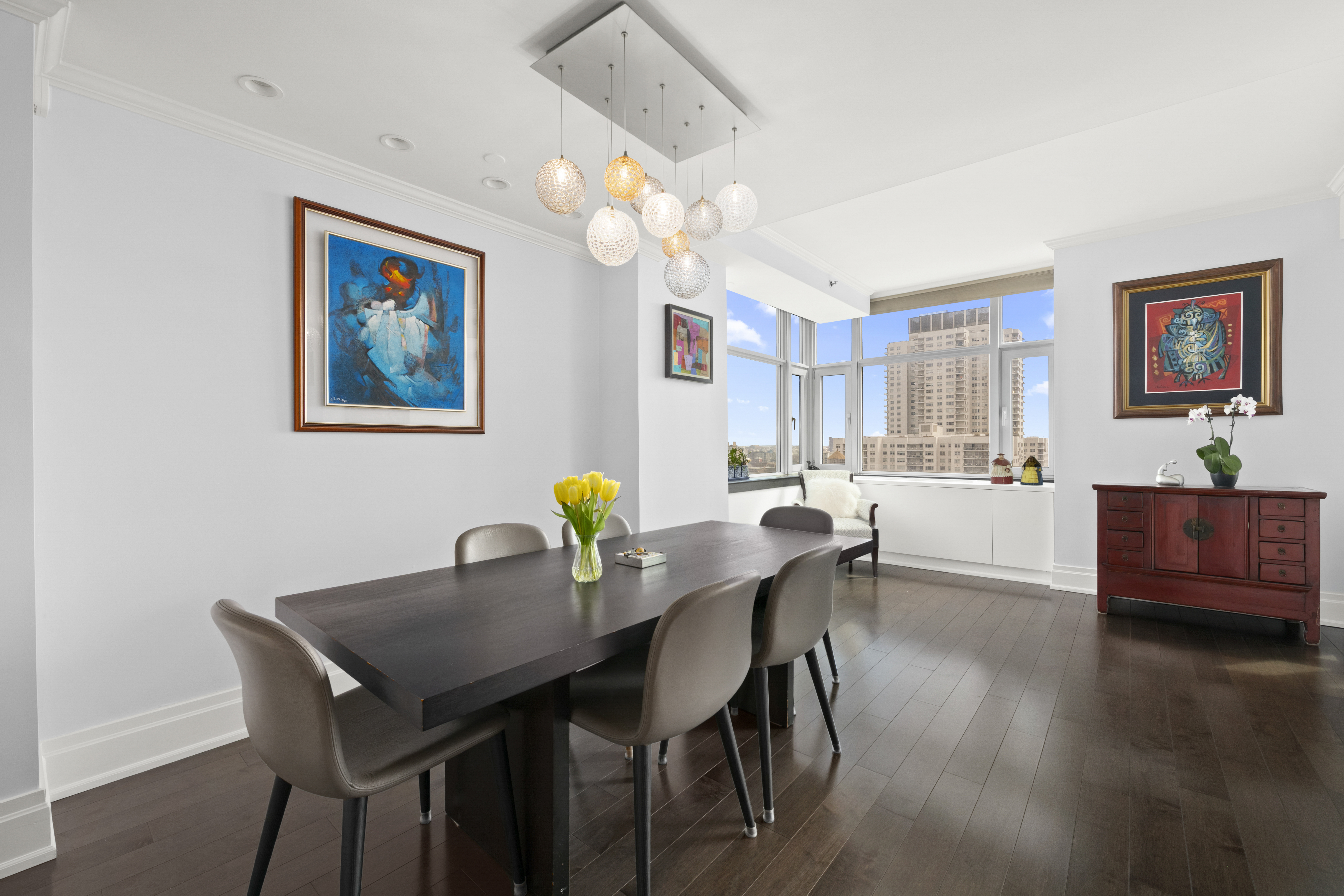 404 East 76th Street, Unit 17A Manhattan, NY 10021 - Photo 3 of 18 a view of a dining room with furniture and wooden floor