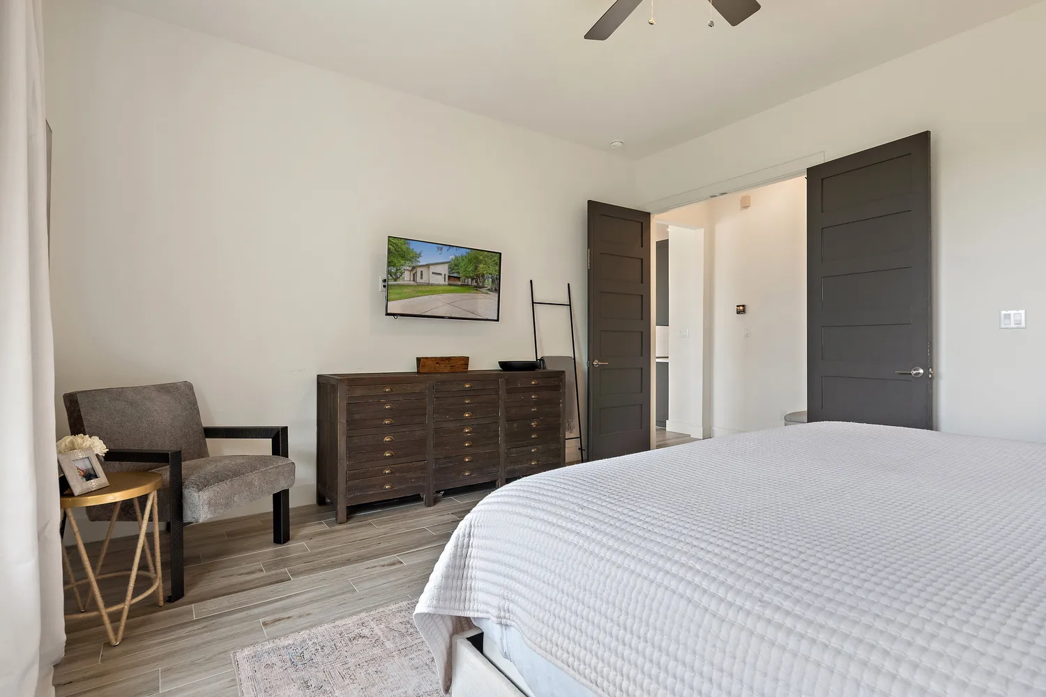 a view of swimming pool with outdoor seating and trees in the background