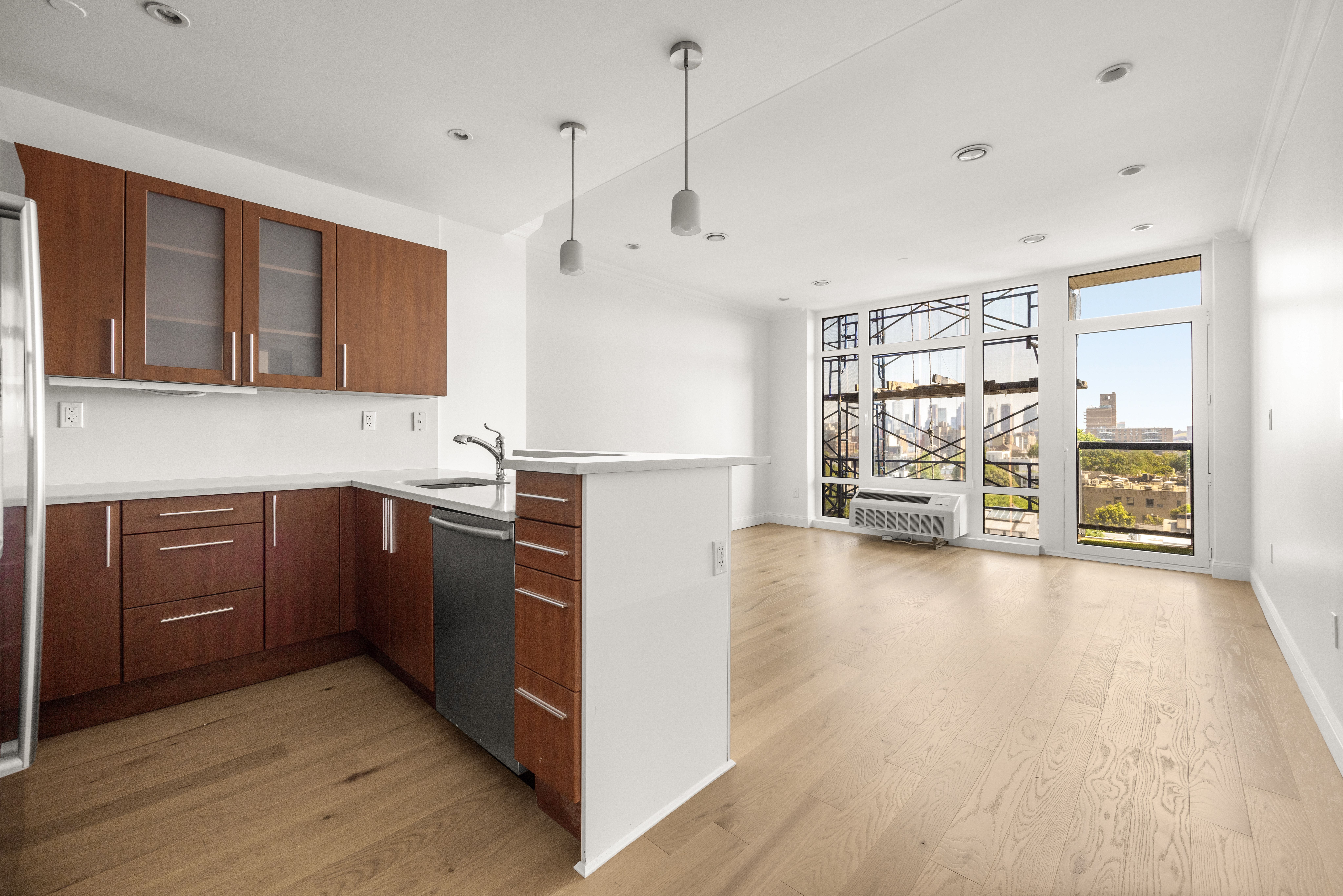 162 16th Street, Unit 7E Brooklyn, NY 11215 - Photo 19 of 23 a kitchen with kitchen island a stove a refrigerator a sink dishwasher with wooden cabinets and floors