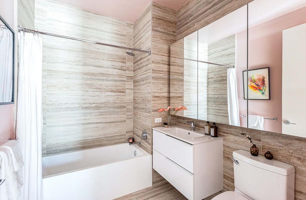 55 Broad Street, Unit 3202 Manhattan, NY 10004 - Photo 9 of 11 a bathroom with a sink and a bathtub