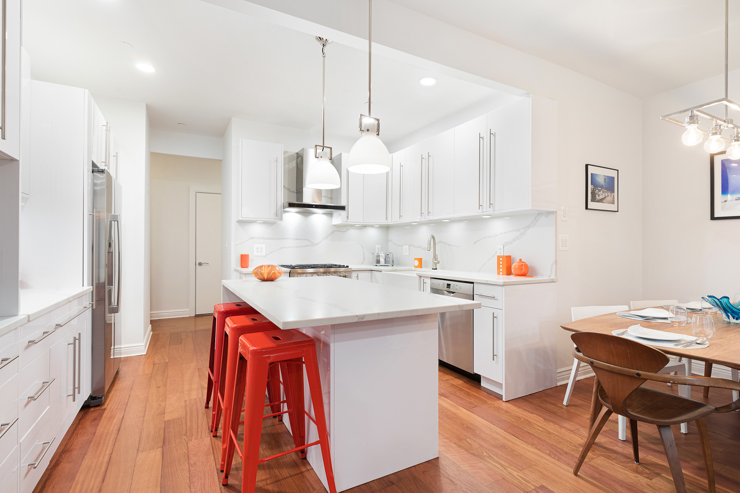 4 Water Street, Unit 2C Brooklyn, NY 11201 - Photo 5 of 21 a kitchen with kitchen island wooden cabinets and white appliances