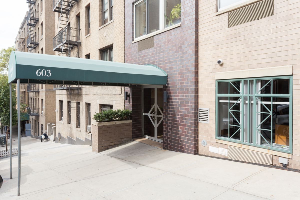 603 West 148th Street, Unit 10A Manhattan, NY 10031 - Photo 10 of 11 a front view of a building with a porch