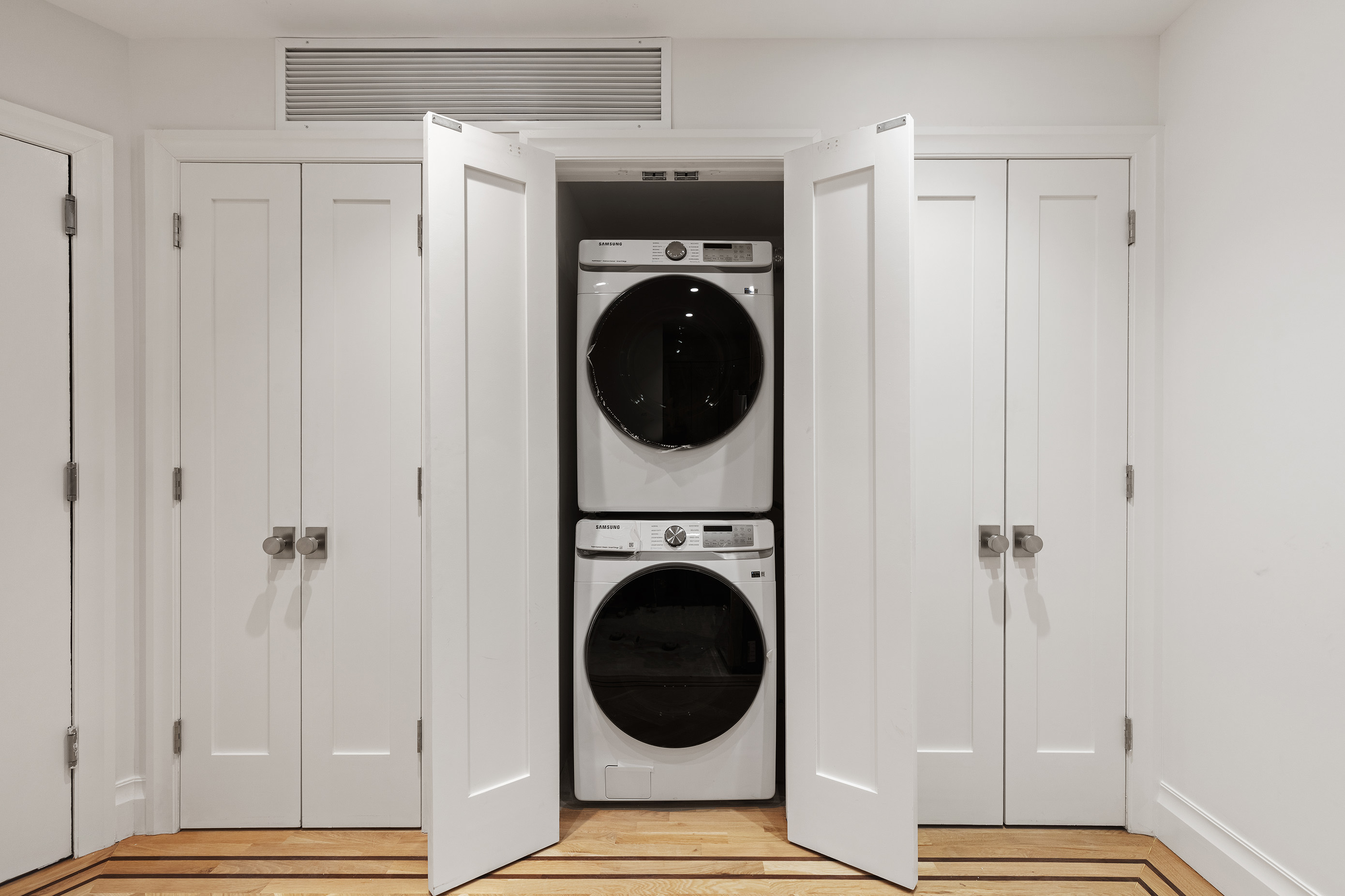 80 7th Avenue, Unit 2 Brooklyn, NY 11217 - Photo 8 of 8 a view of a bedroom with washer and dryer