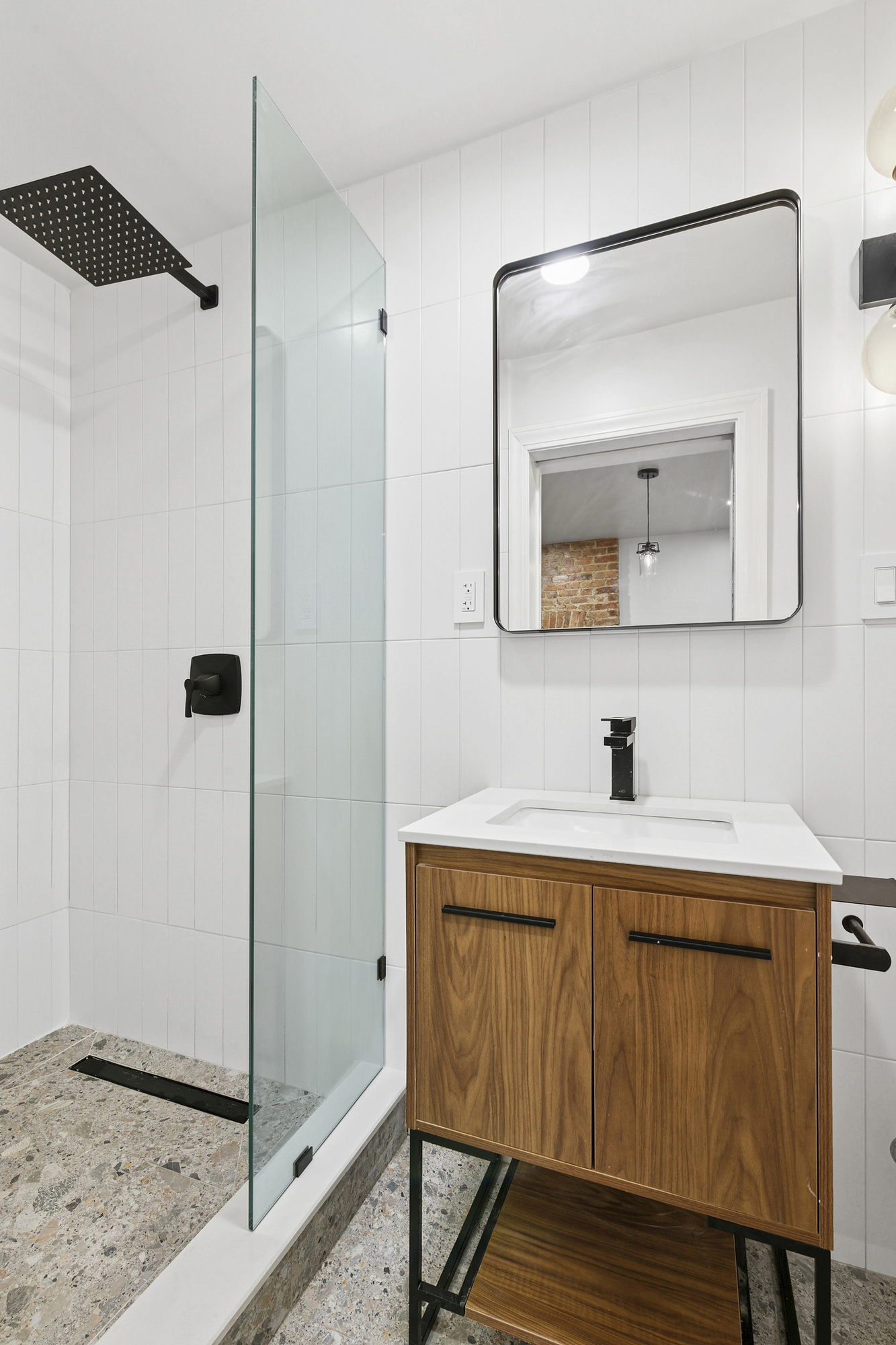 555 MacDonough Street, Unit 1 Brooklyn, NY 11233 - Photo 3 of 7 a bathroom with a toilet sink and mirror