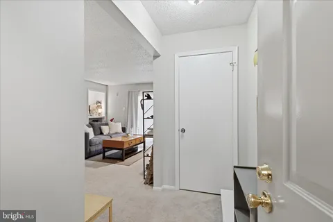 a room with a window and lounge chair