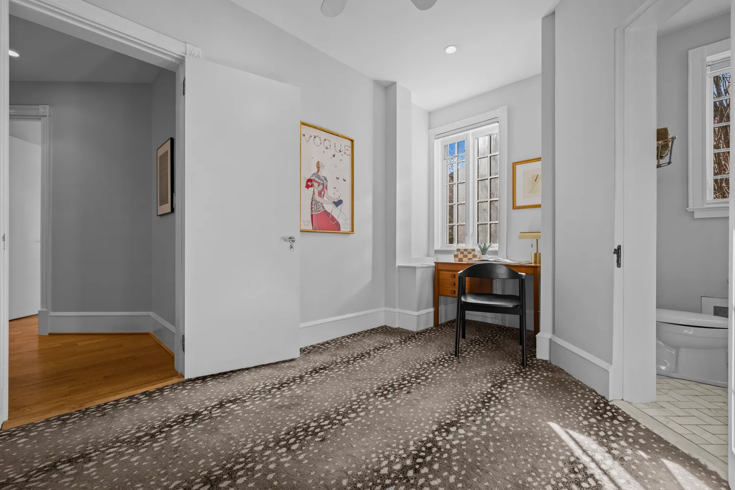 a living room with furniture and a rug