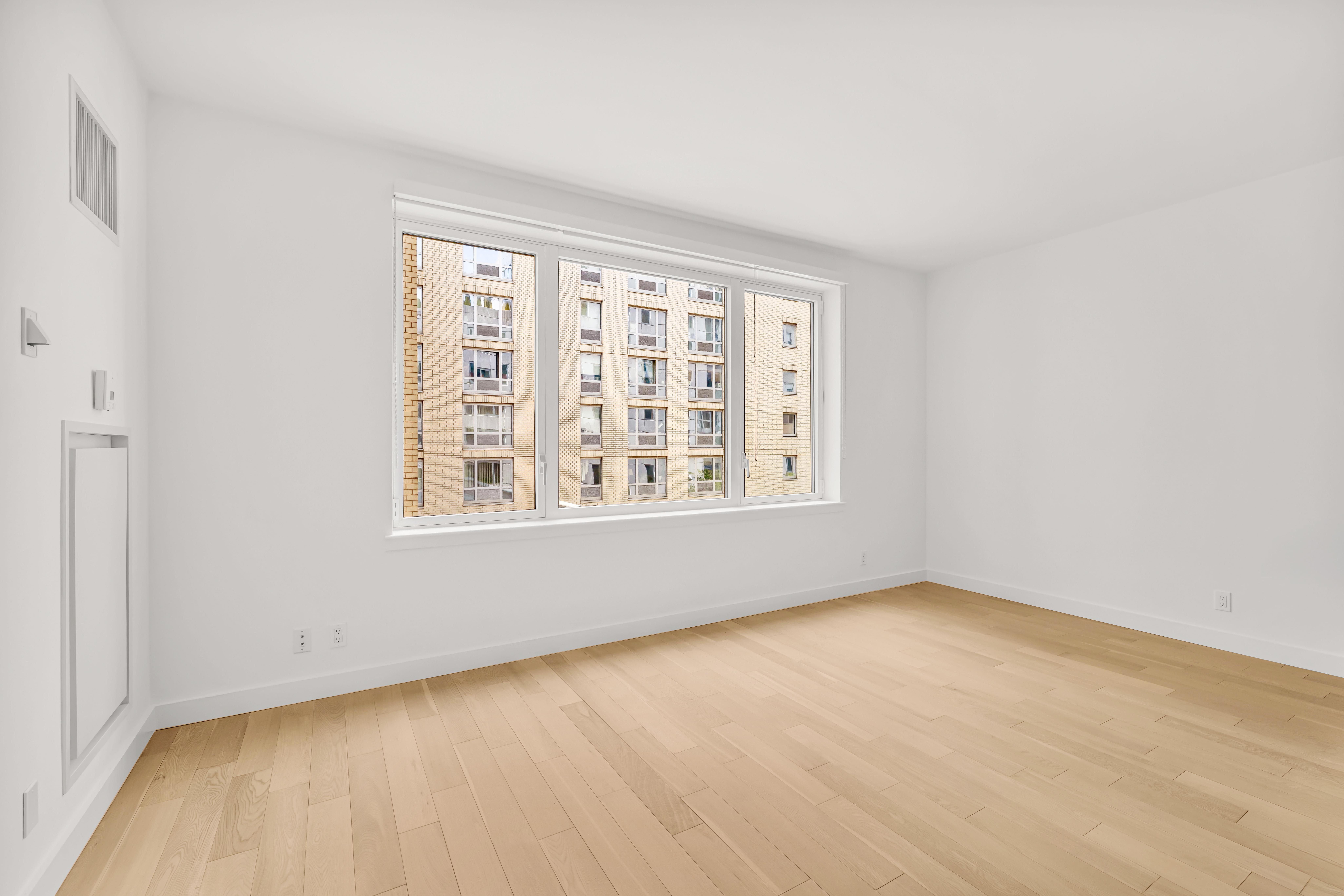 34 North 7th Street, Unit 3Z Brooklyn, NY 11249 - Photo 1 of 14 an empty room with a window