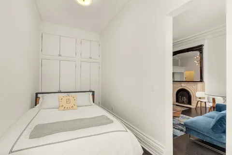 a bedroom with a bed and a view of bathroom