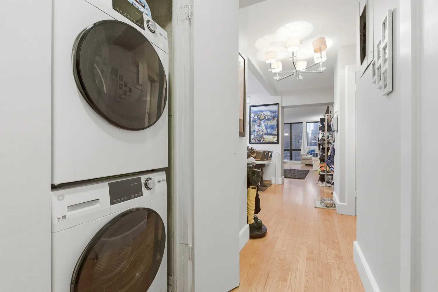 a view of a hallway with washer and dryer