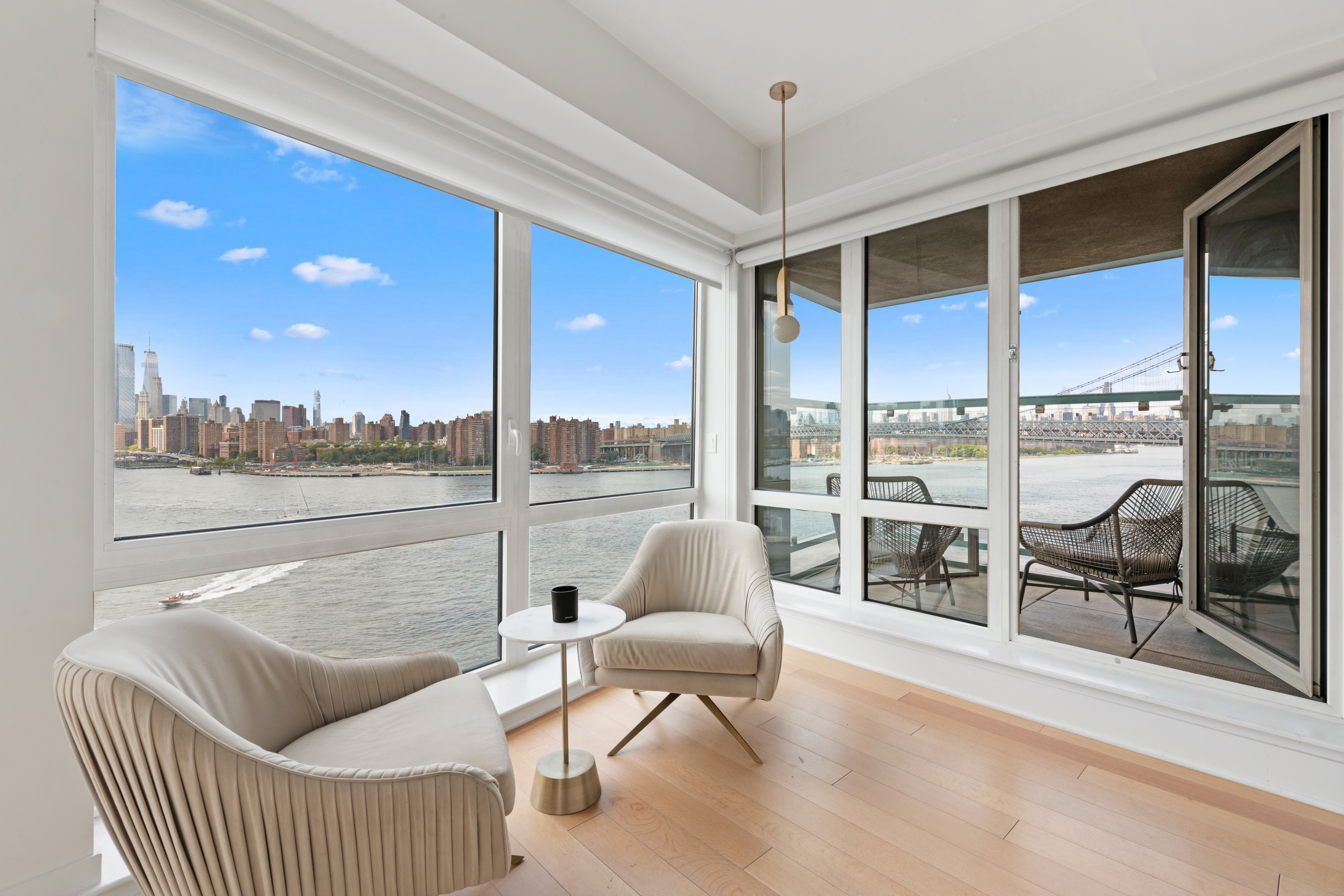 446 Kent Avenue, Unit 14A Brooklyn, NY 11249 - Photo 8 of 19 a living room with furniture and a floor to ceiling window