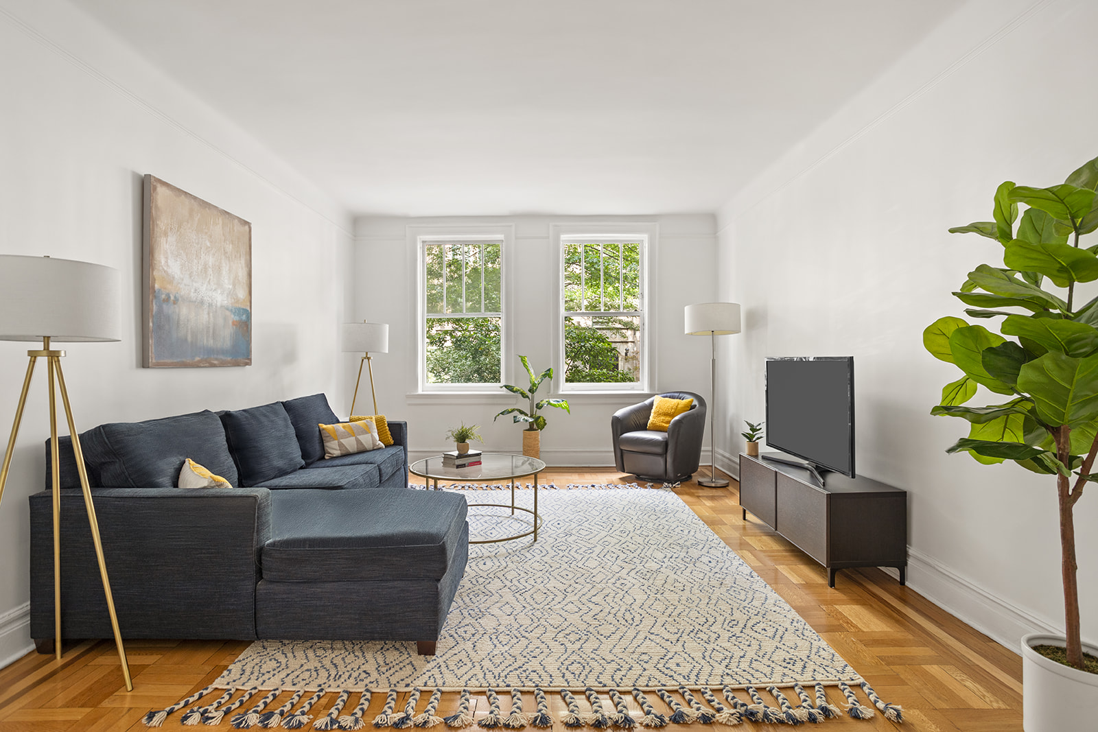 a living room with furniture or couch and a flat screen tv