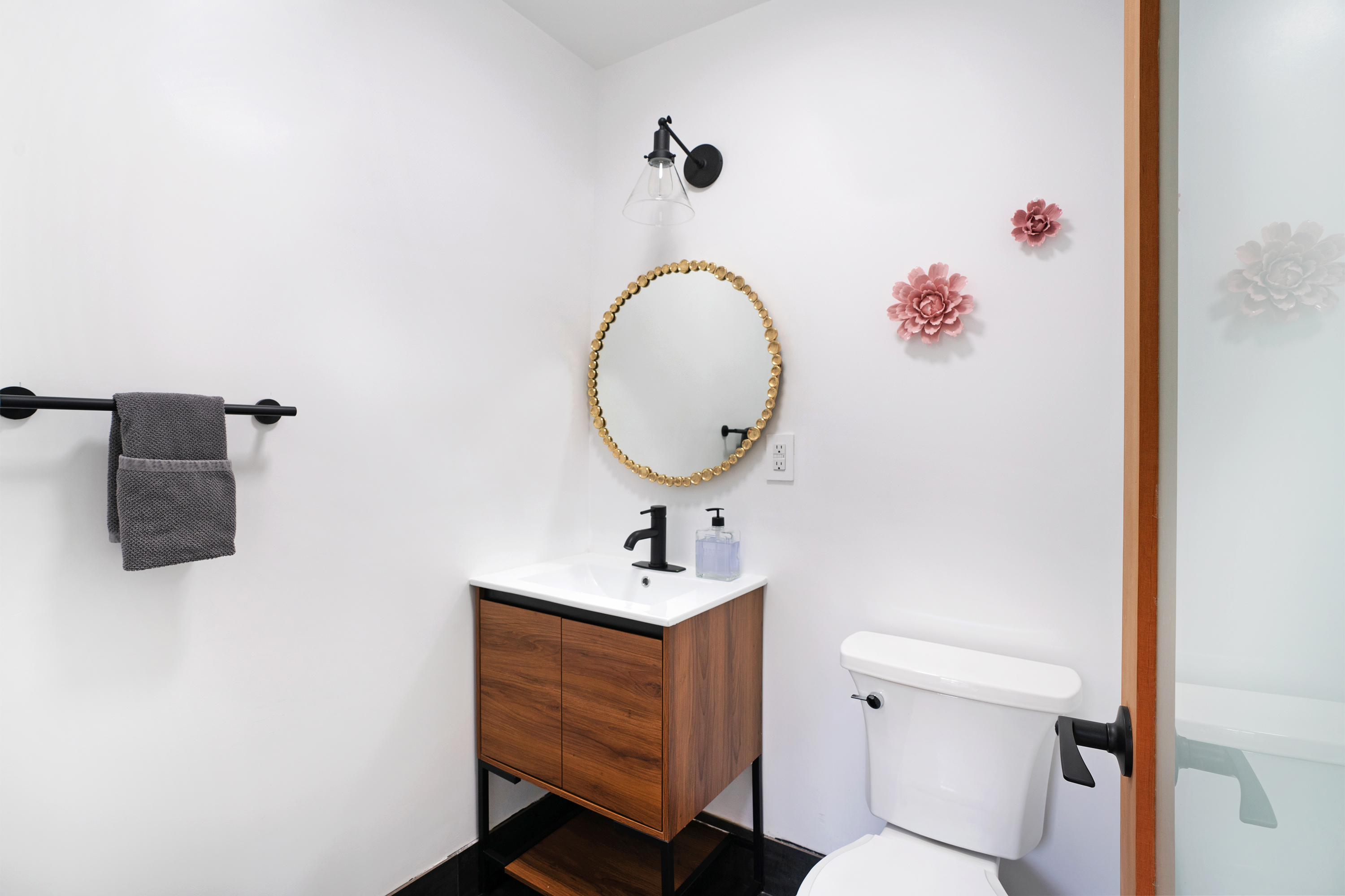 334 Plymouth Street, Unit PH Brooklyn, NY 11201 - Photo 12 of 16 a bathroom with a sink vanity mirror and toilet
