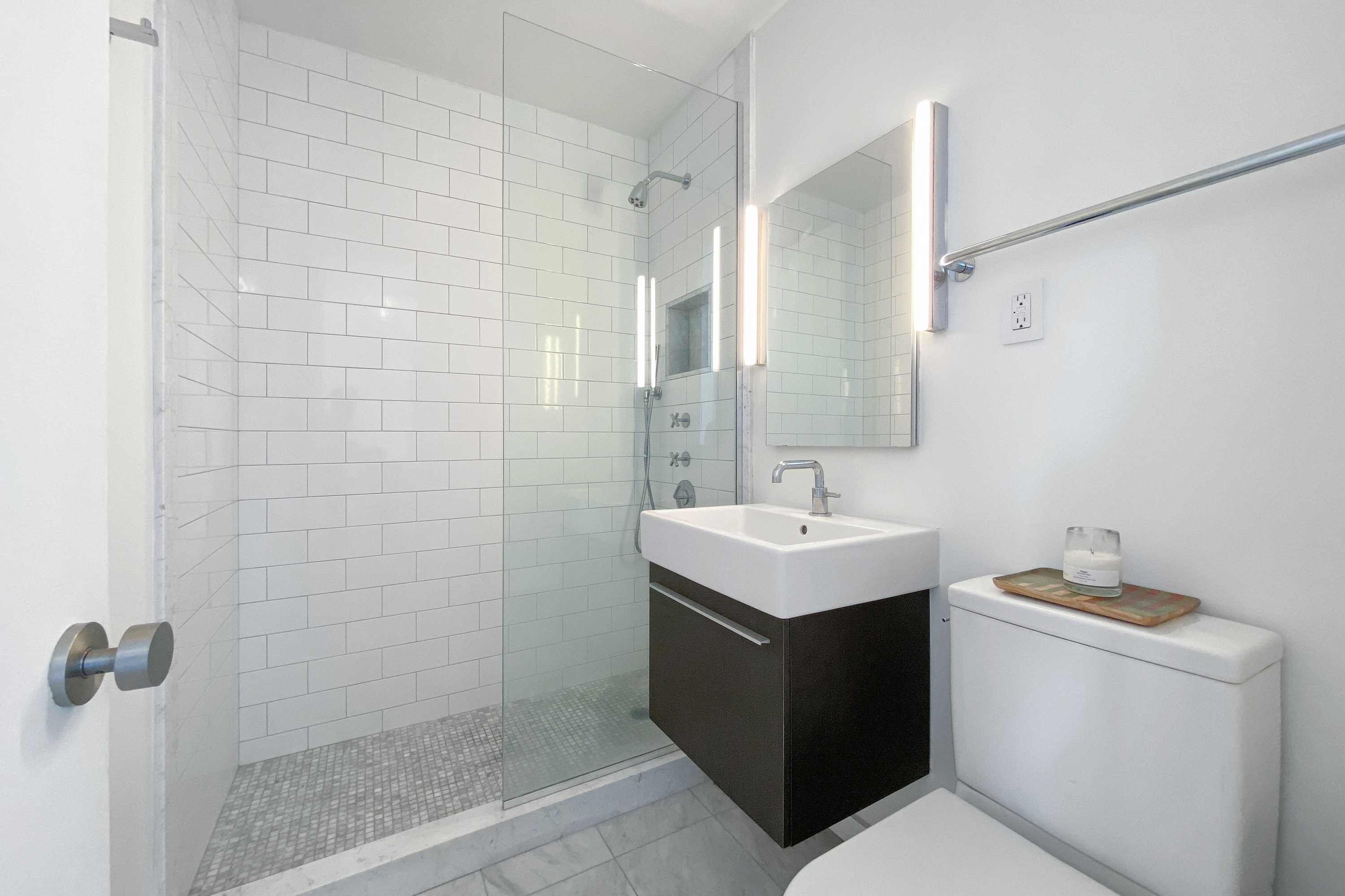 343 East 30th Street, Unit 18A Manhattan, NY 10016 - Photo 6 of 17 a bathroom with a sink toilet and shower