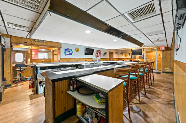 a view of a kitchen with stainless steel appliances lots of counter top space