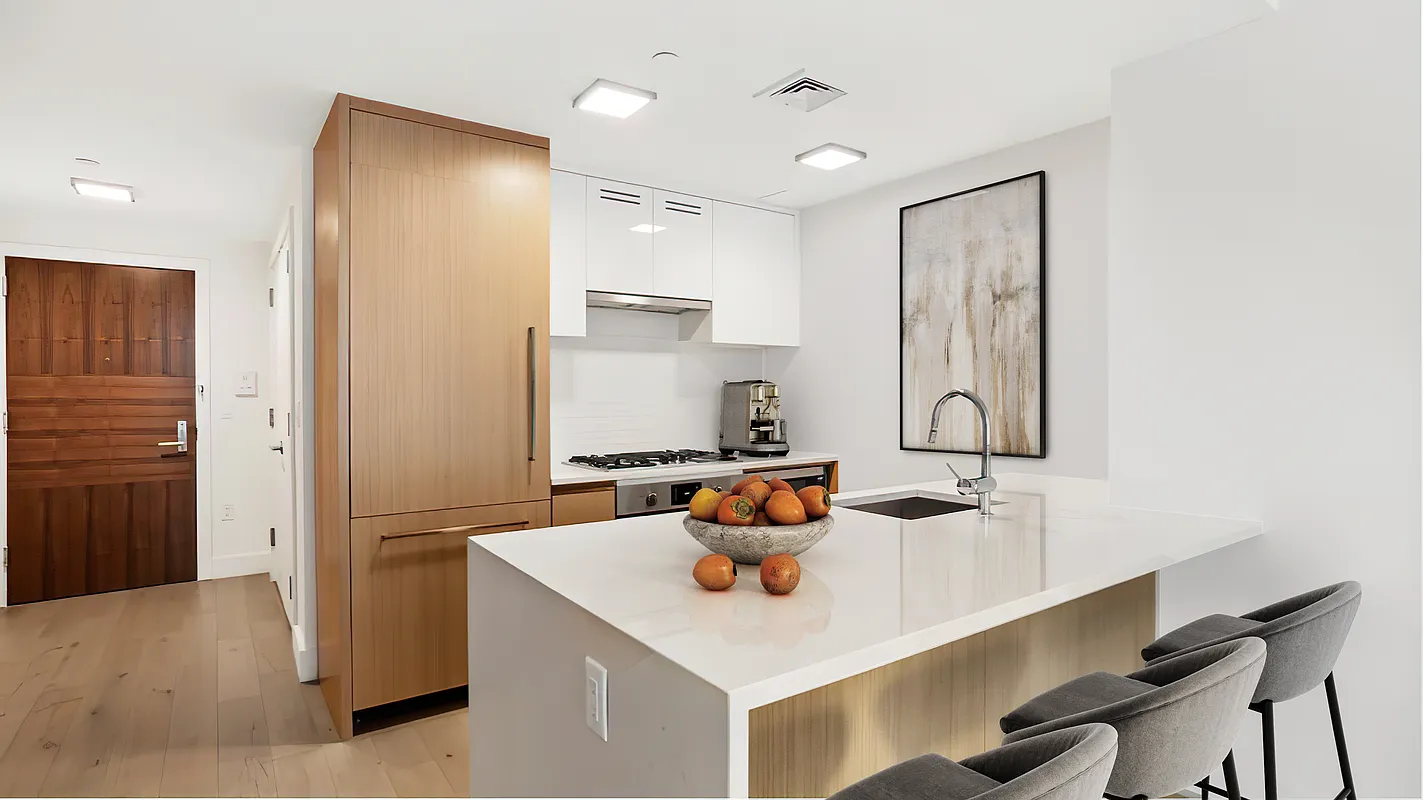319 Schermerhorn Street, Unit 10D Brooklyn, NY 11217 - Photo 2 of 9 a kitchen with a sink a stove and a refrigerator
