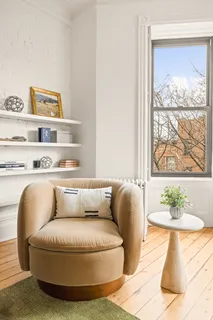 a living room with furniture and window