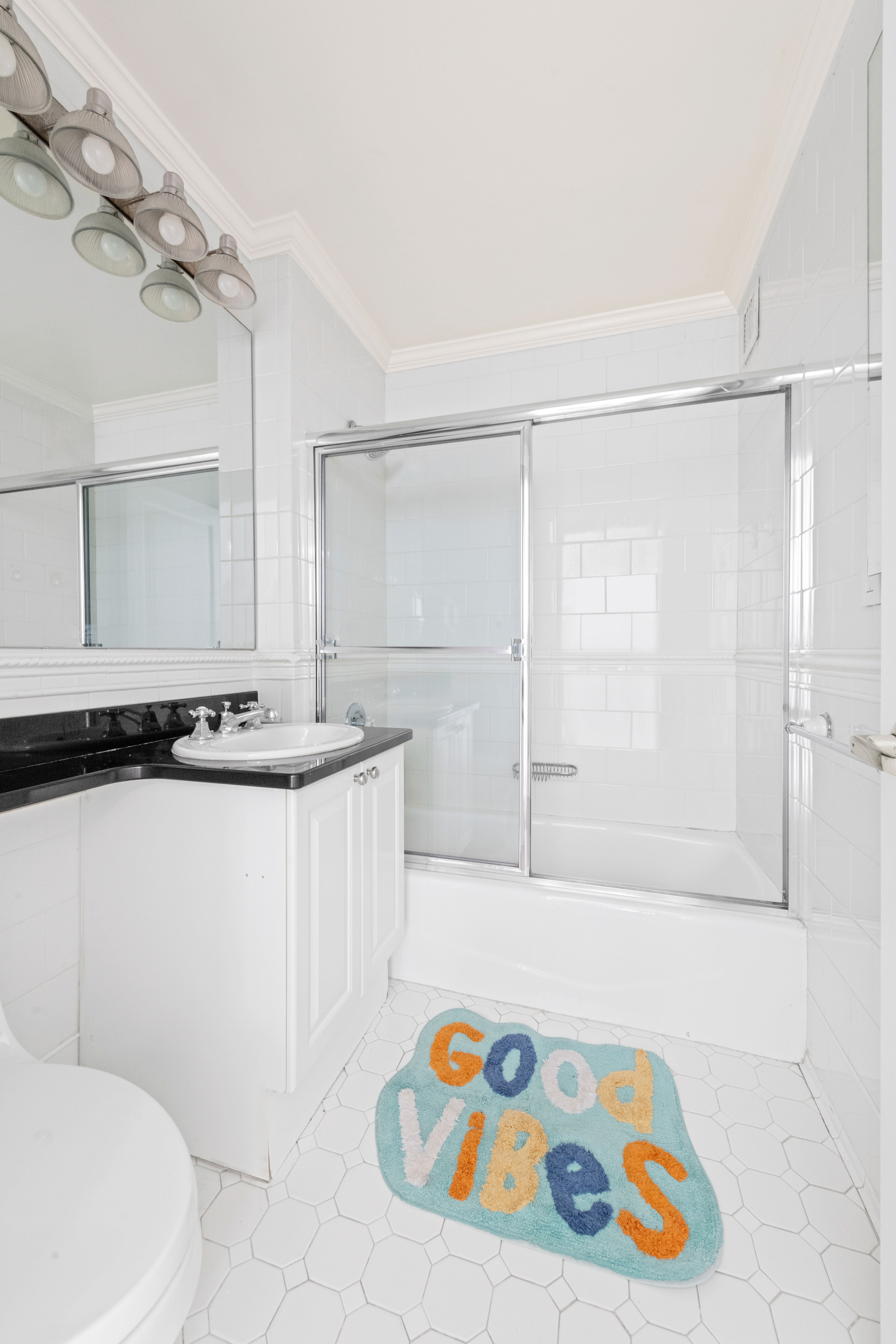 404 East 76th Street, Unit 8A Manhattan, NY 10021 - Photo 12 of 17 a bathroom with a bathtub and a shower
