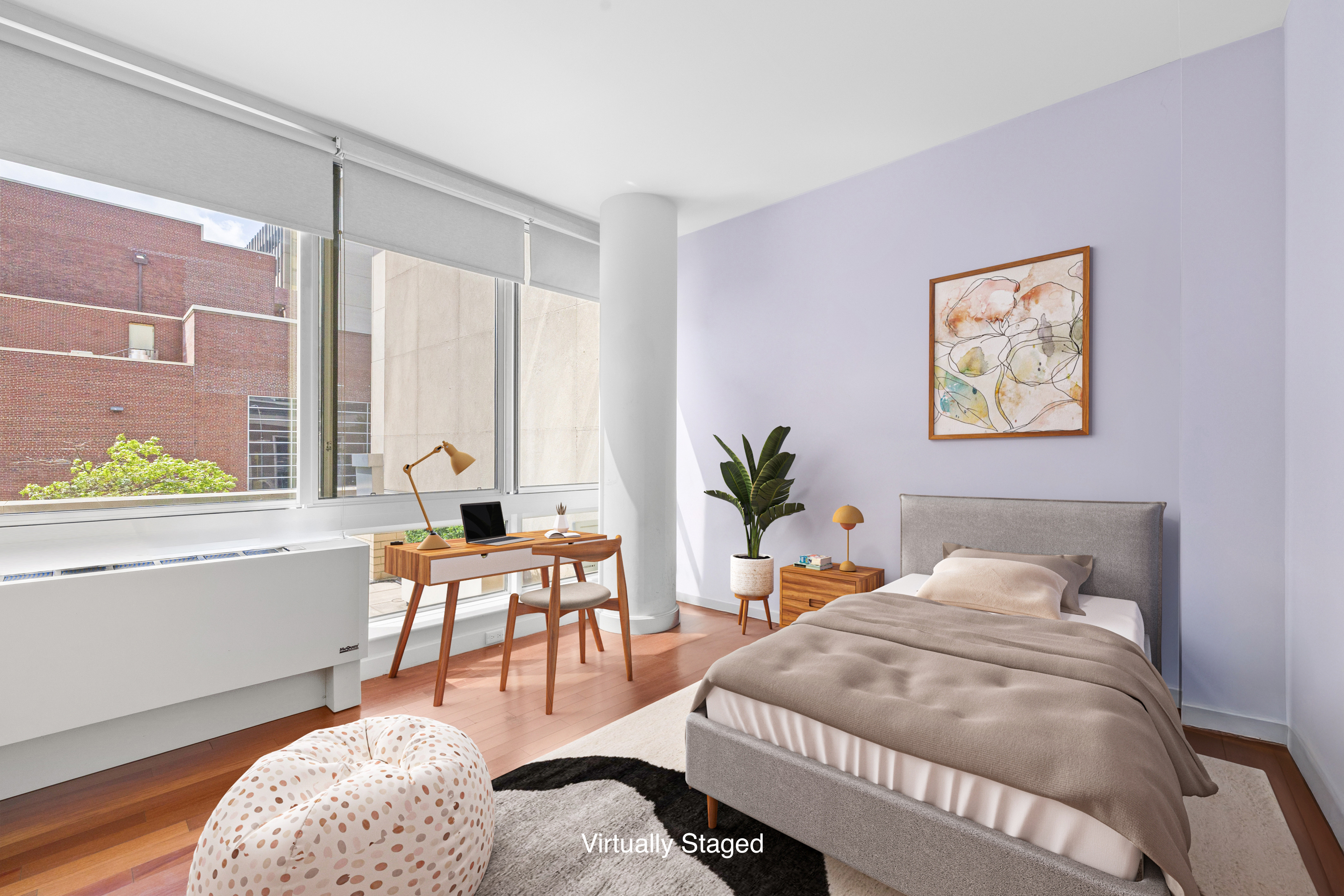 107-24 71st Road, Unit 2E Queens, NY 11375 - Photo 9 of 18 a bedroom with furniture and a large window