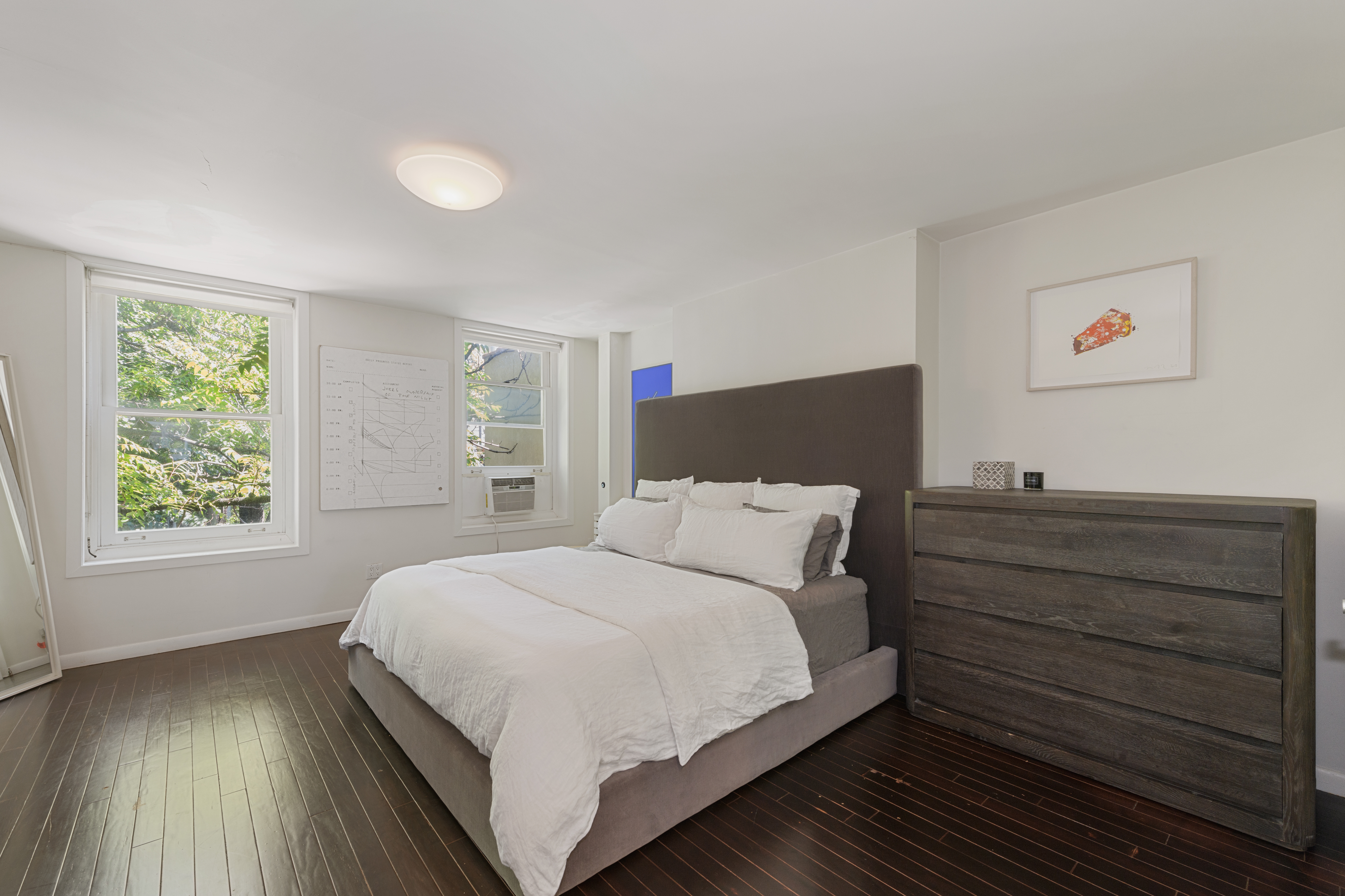 24 Greenwich Avenue, Unit 2 Manhattan, NY 10011 - Photo 4 of 6 a bedroom with a bed and a window