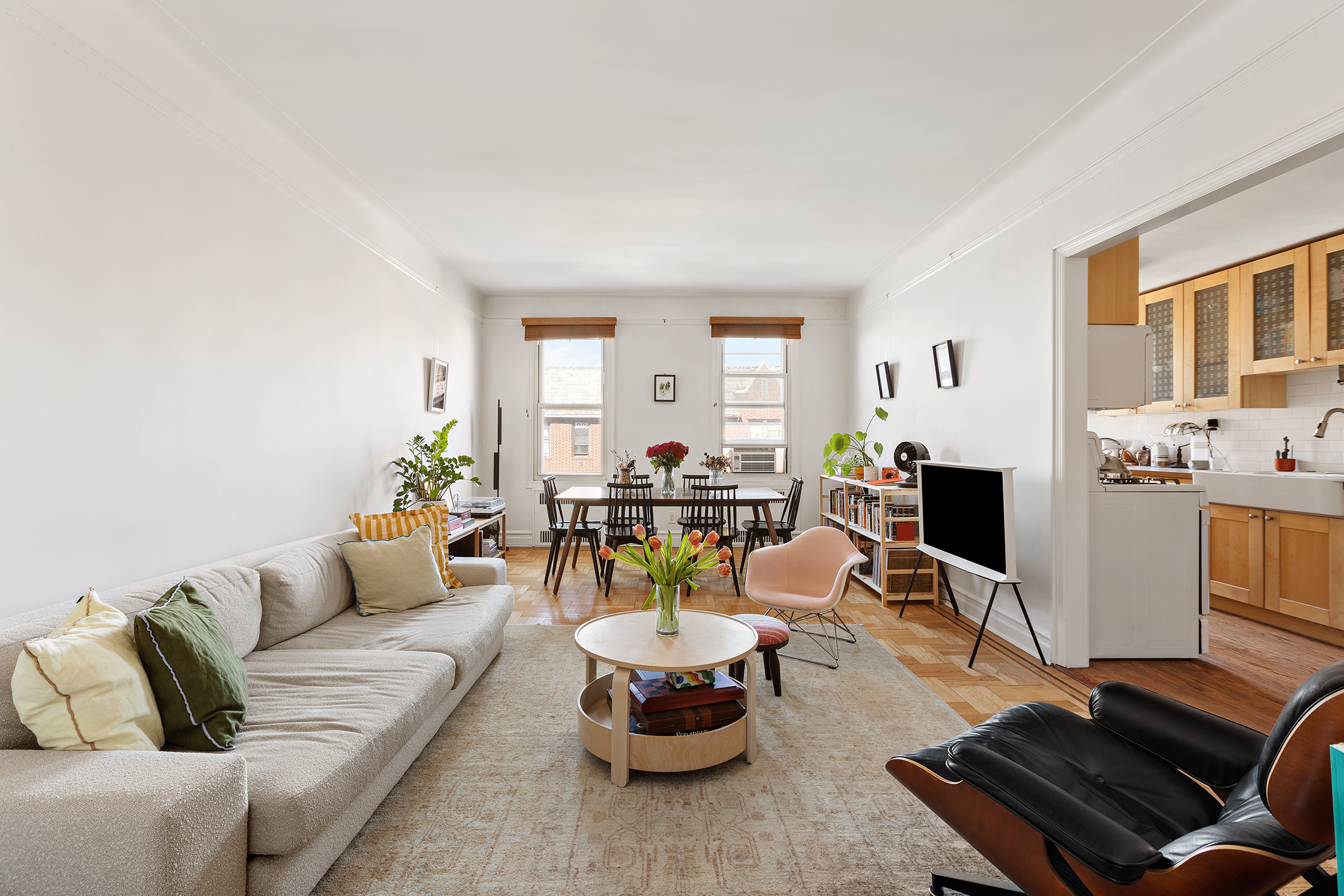 a living room with furniture fireplace and a window