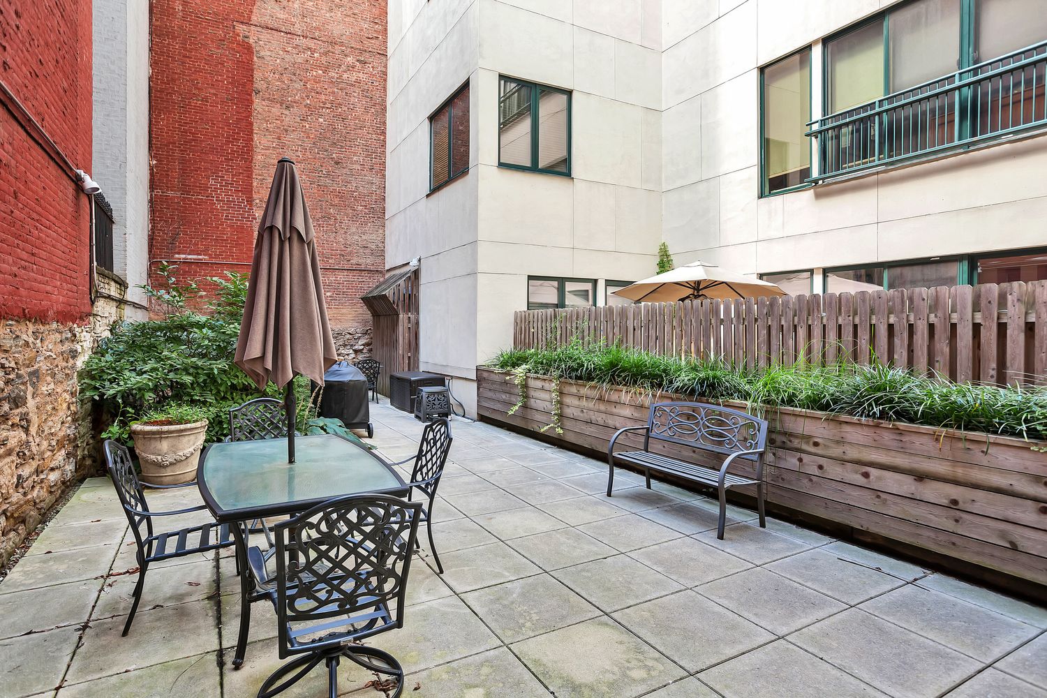 2056 5th Avenue, Unit 2B Manhattan, NY 10035 - Photo 12 of 13 a view of a chairs and tables in the back yard of the house